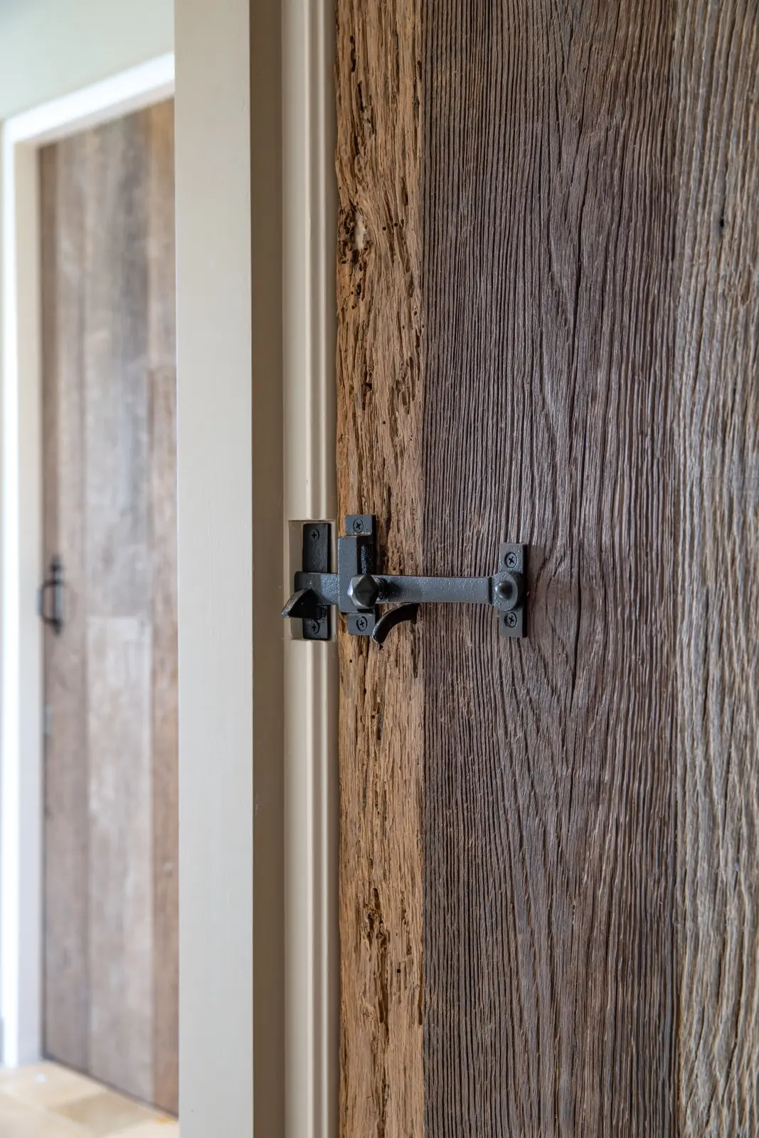 Oak interior doors with timeless design and authentic natural wood finish in a bright hallway