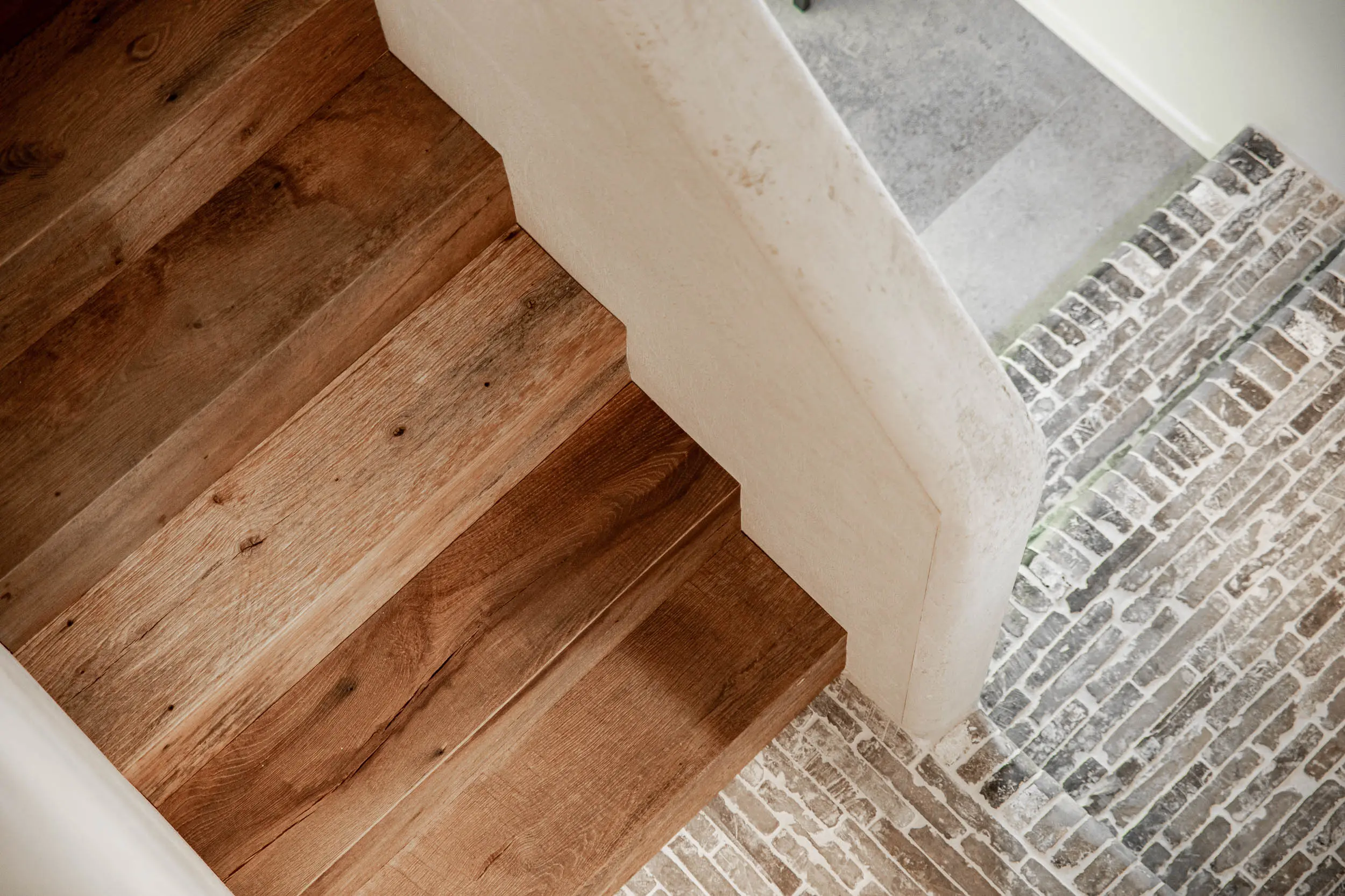 Custom wooden staircase with natural oak steps and rustic finish
