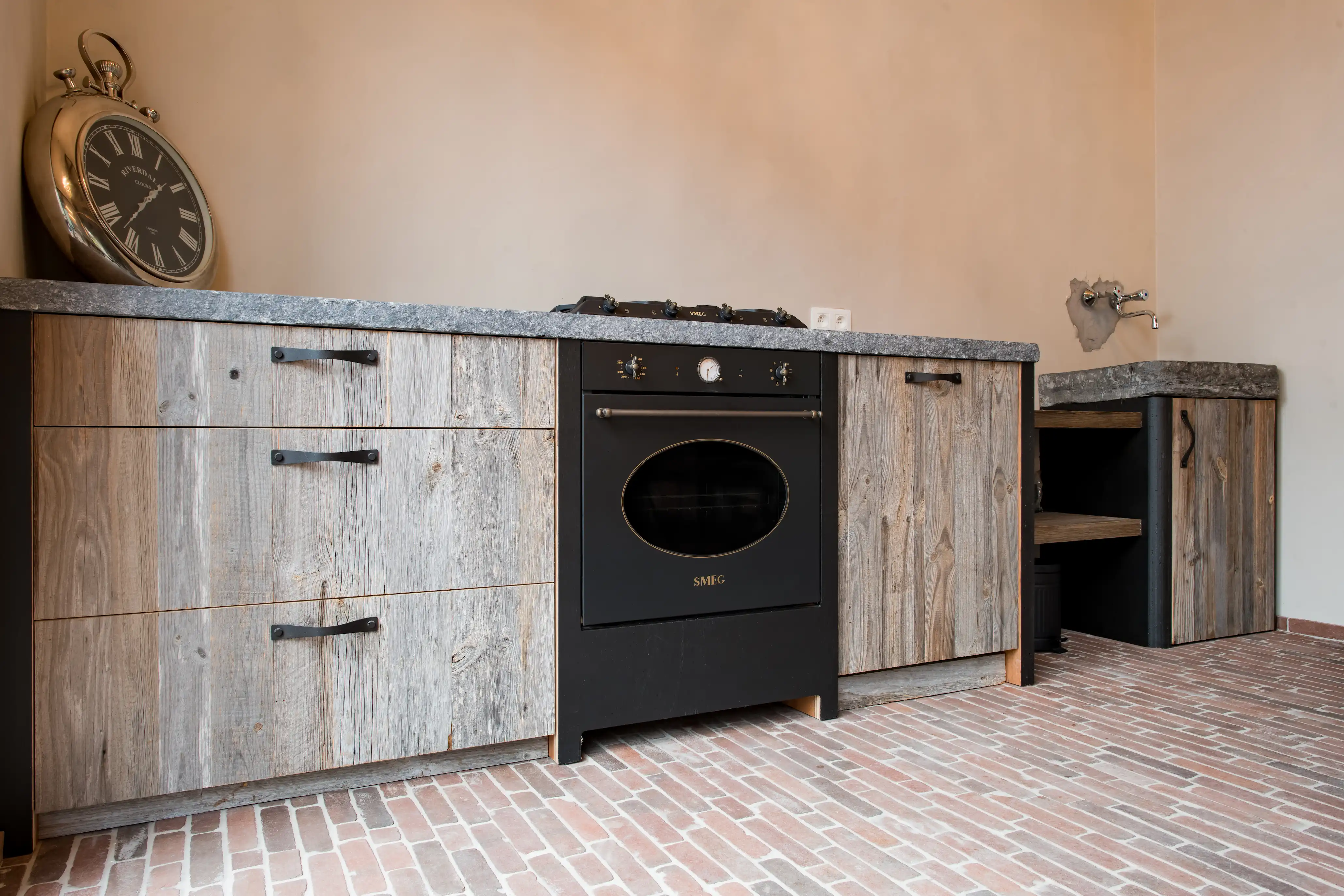 Rustic kitchen cabinets made from reclaimed alpine wood with natural wood texture.