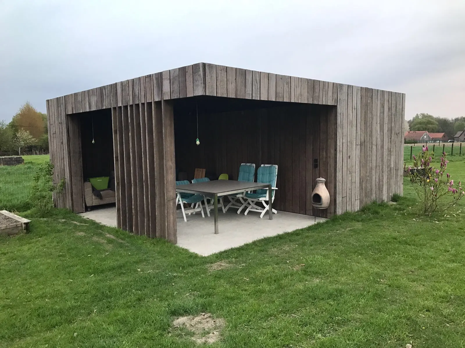 Reclaimed Azobé ship planks used for exterior cladding with authentic aged timber appearance