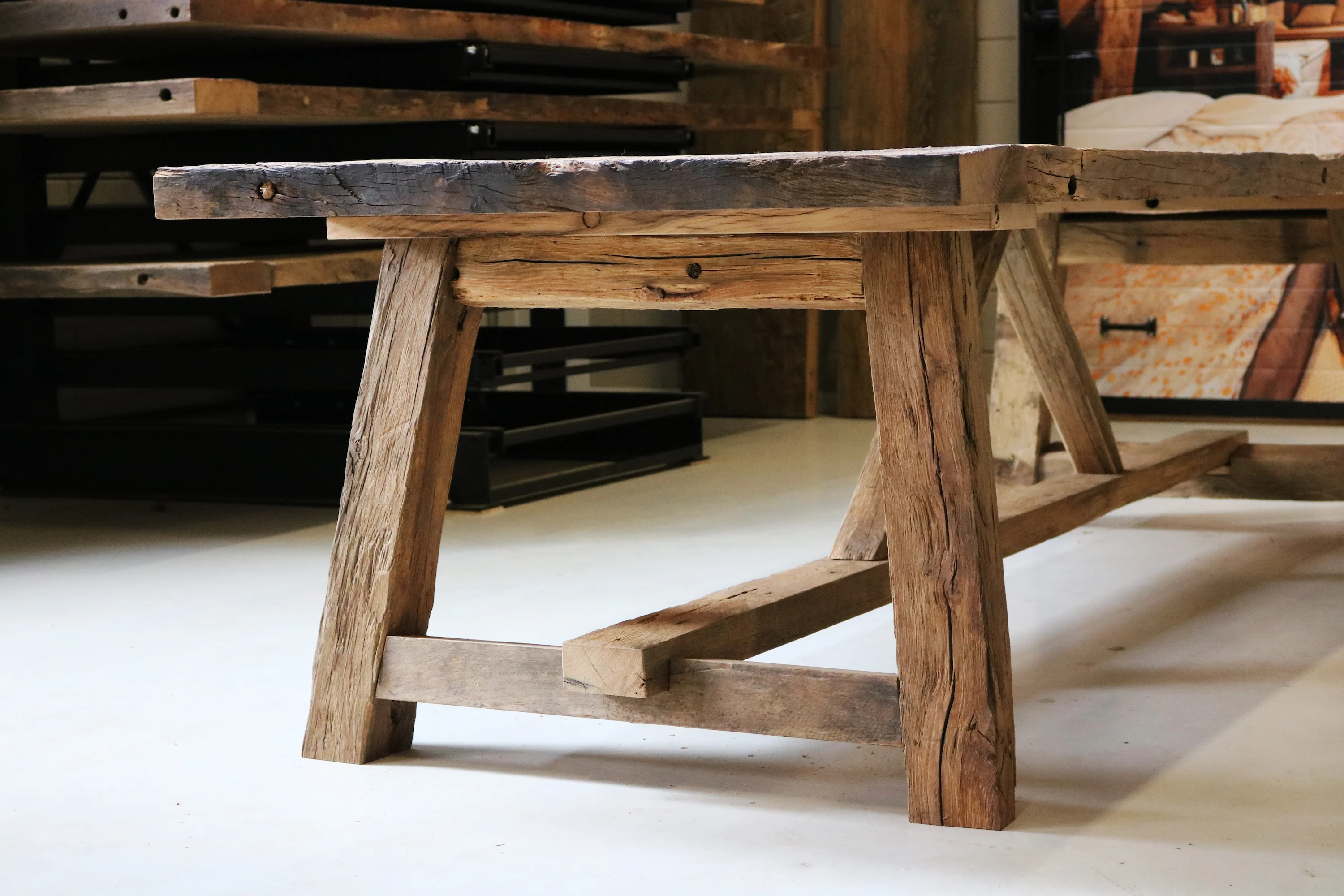 Industrial-style table combining reclaimed wood and steel legs