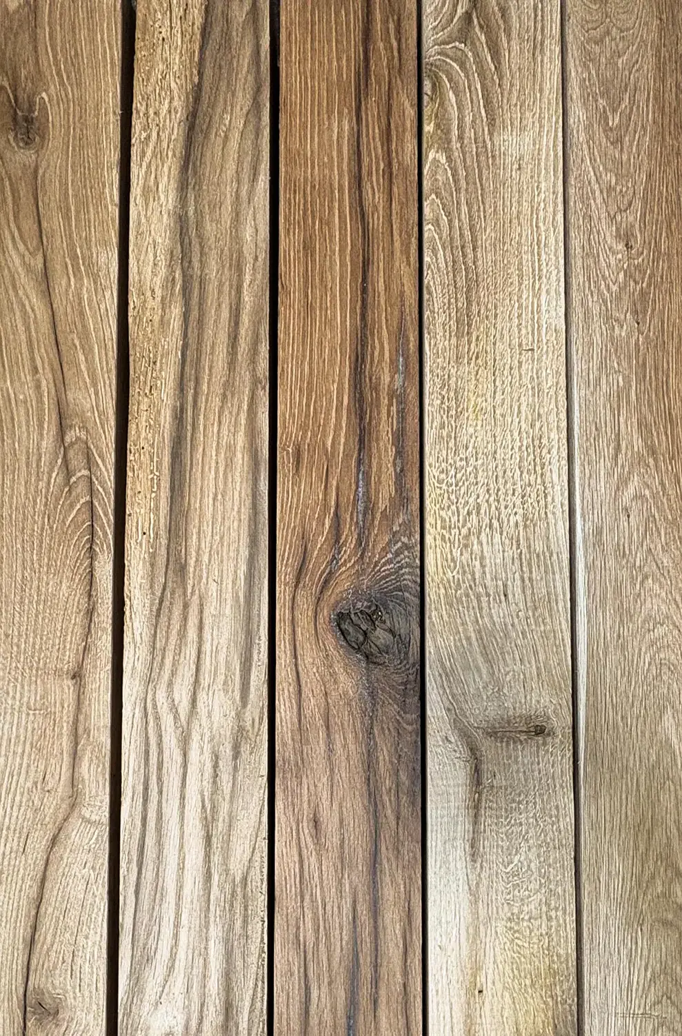 Weathered barnwood timber with cracks and knots