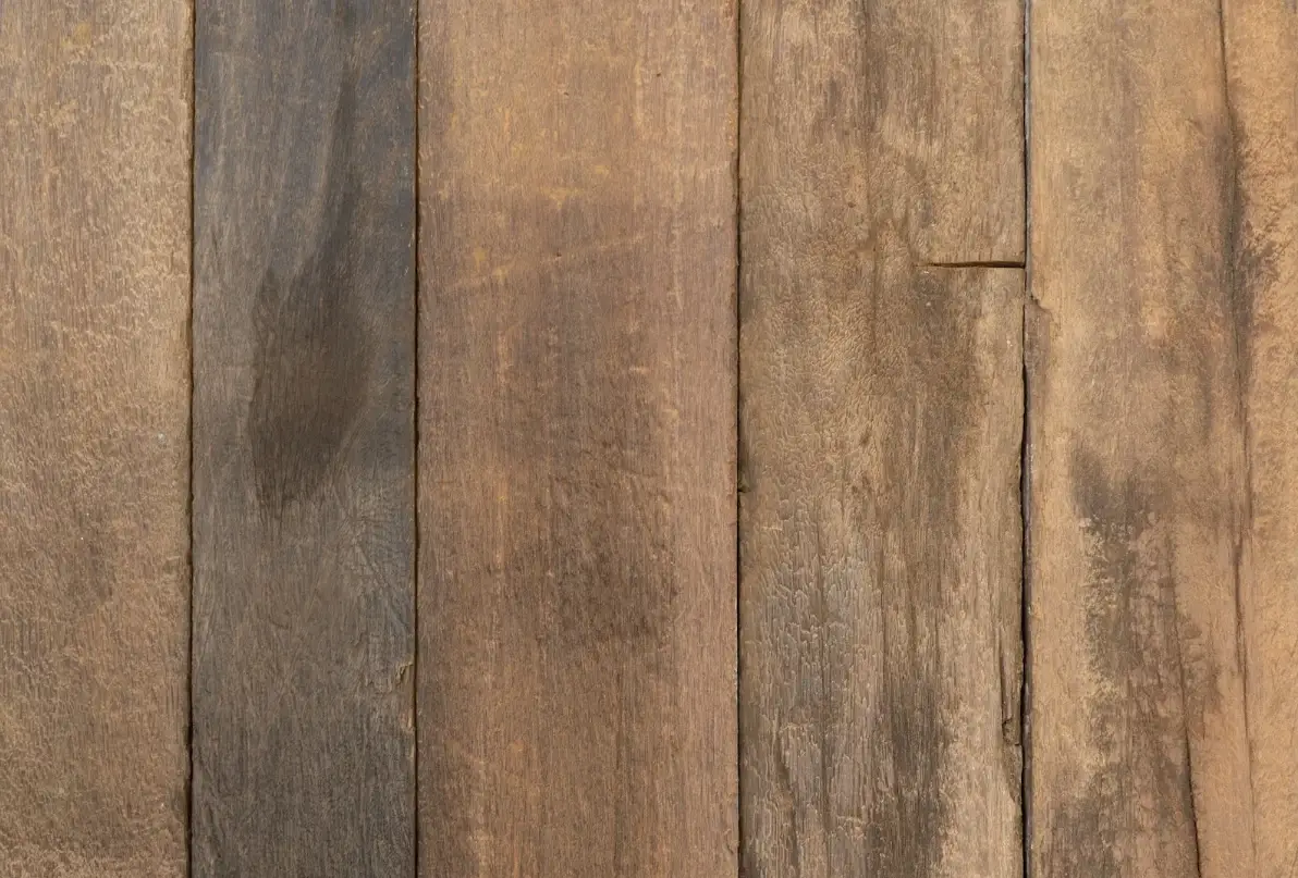 Reclaimed wood wall cladding with weathered texture and authentic rustic appearance.