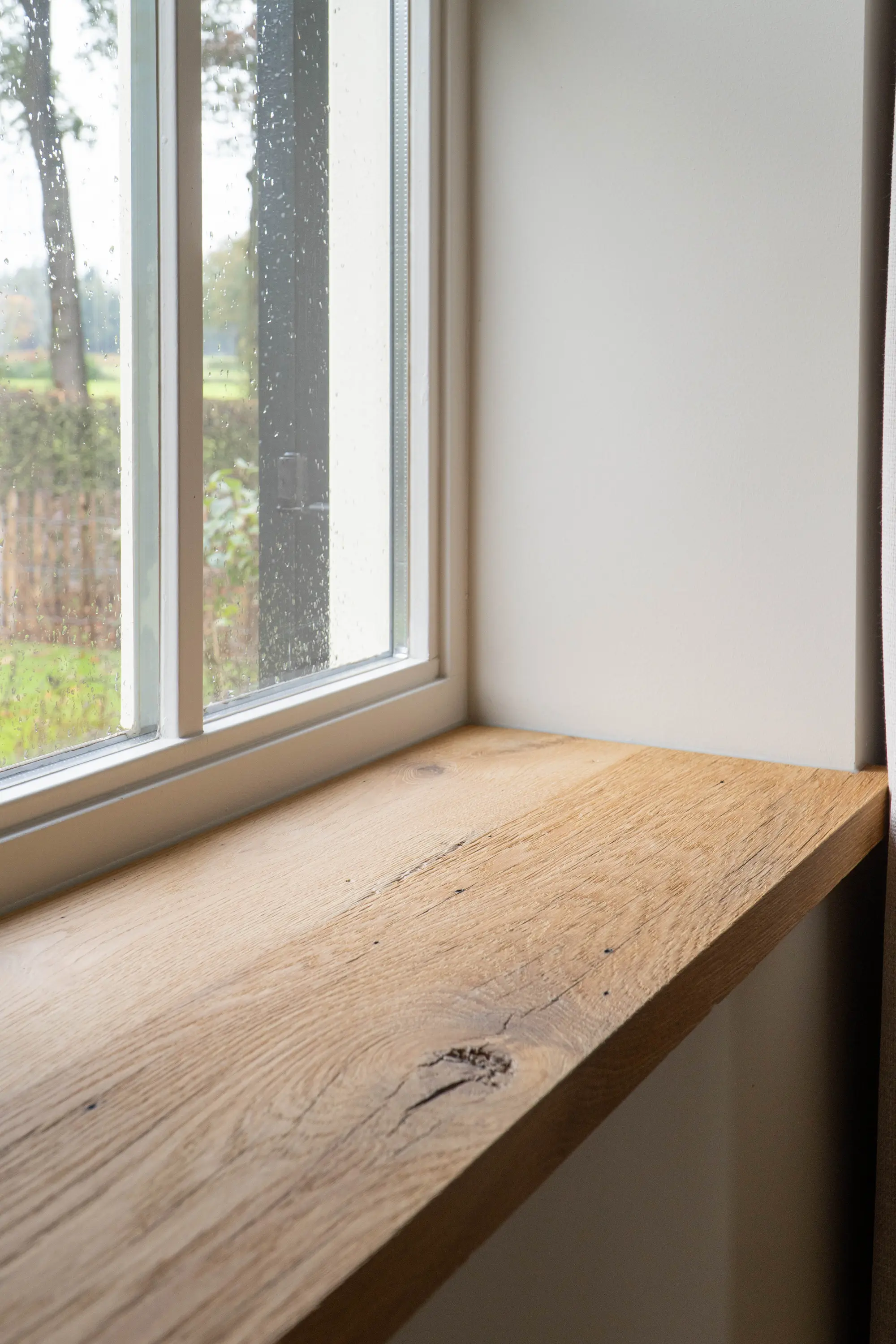 Rustic oak window sill with visible wood grain