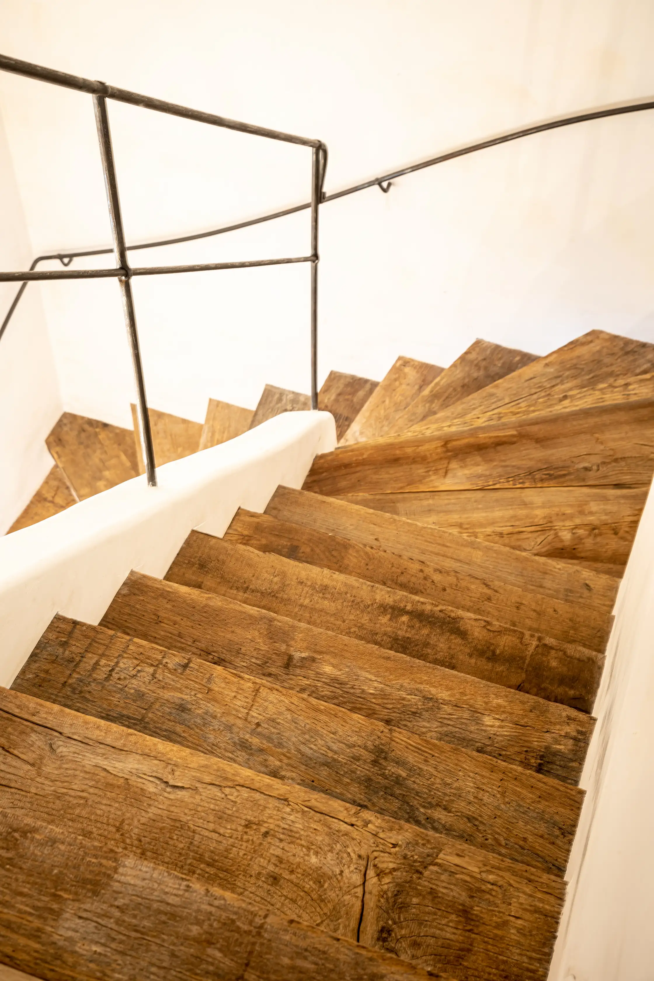 Interior staircase made from reclaimed old oak wood with rustic charm.
