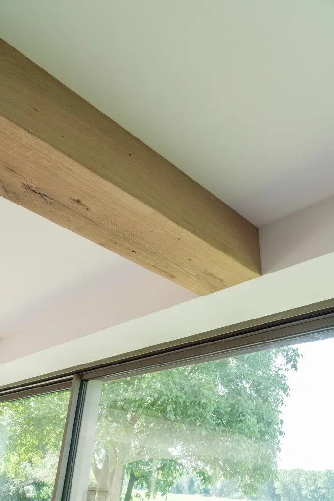 Faux antique ceiling beam with rustic texture and handcrafted reclaimed wood look.
