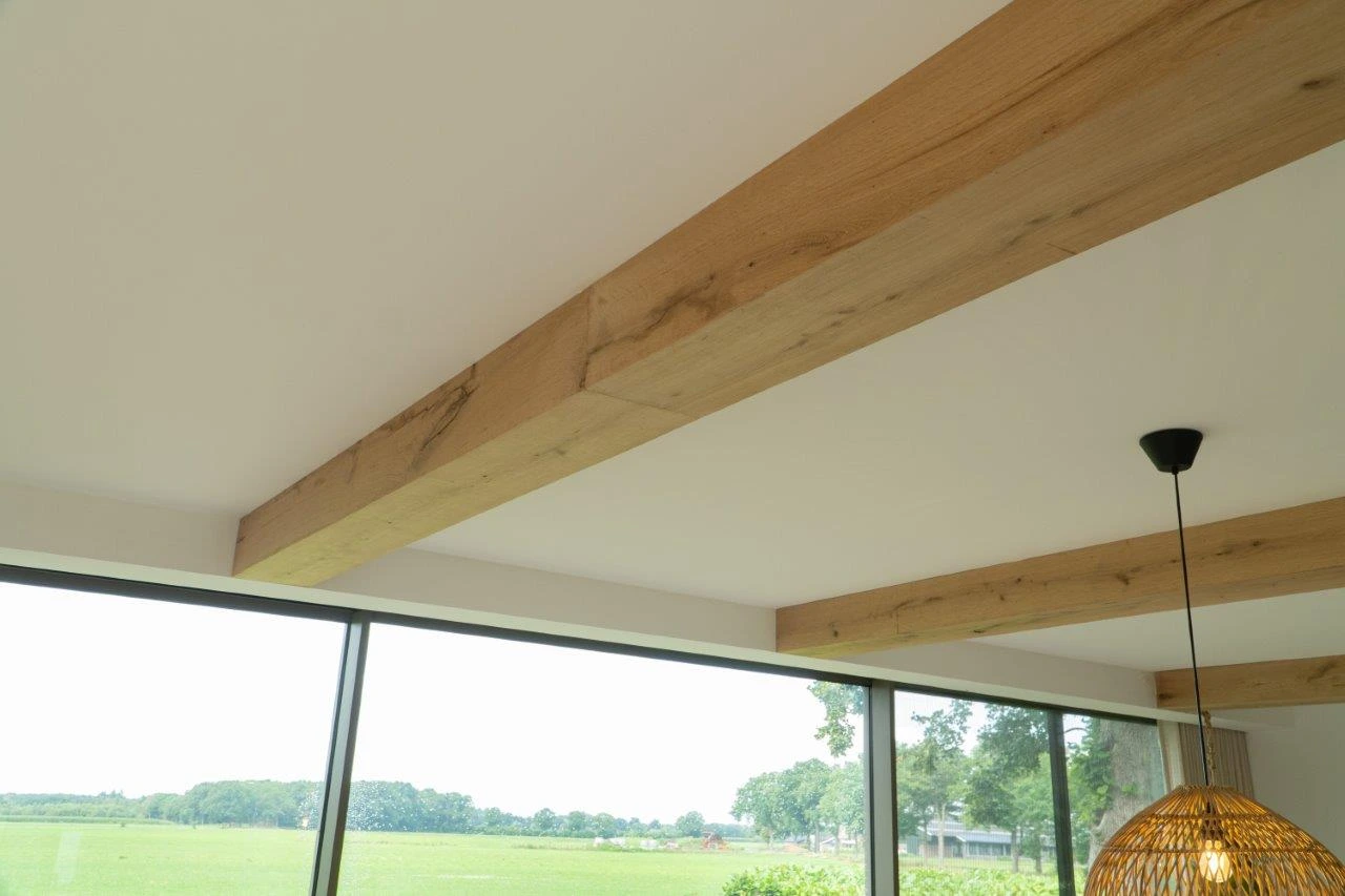 Decorative faux oak beam cover with aged wood look for rustic interior design.
