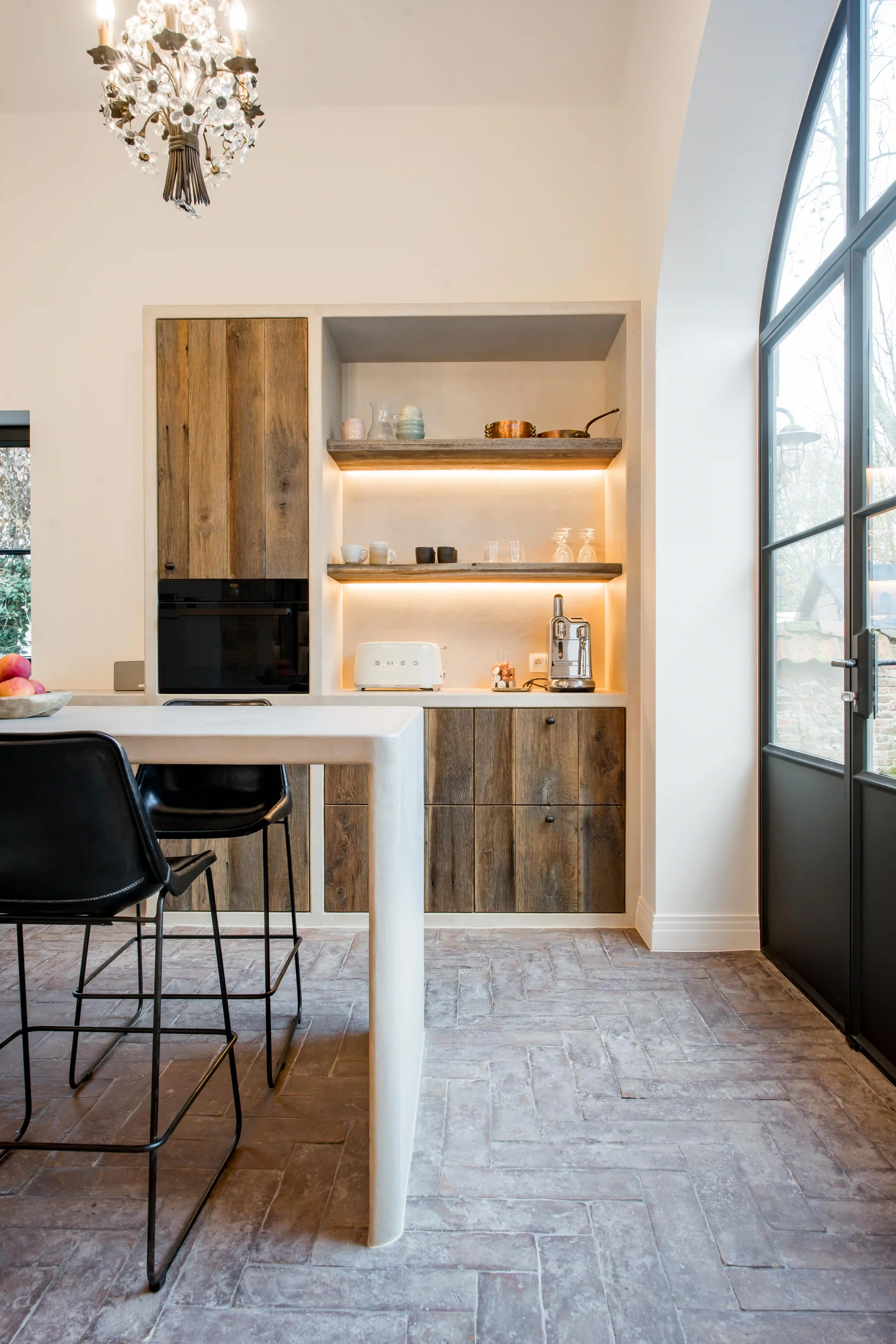 Modern kitchen with reclaimed wood shelves and rustic cabinet fronts made from aged timber