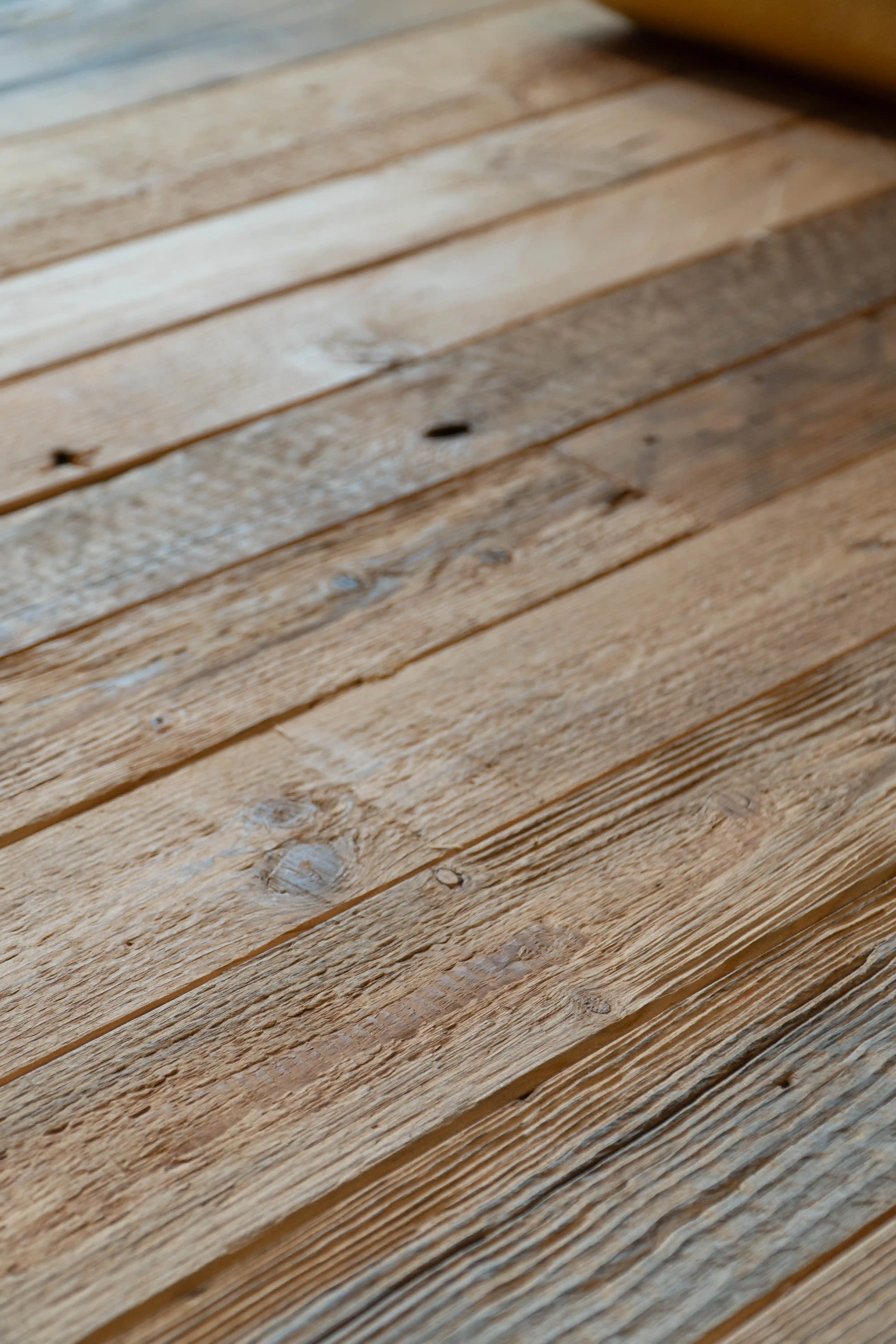Luxury interior featuring reclaimed oak floorboards with natural color variations and aged finish