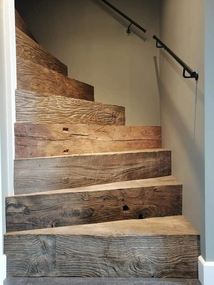 Custom made reclaimed wood staircase with rustic oak finish and authentic aged texture.
