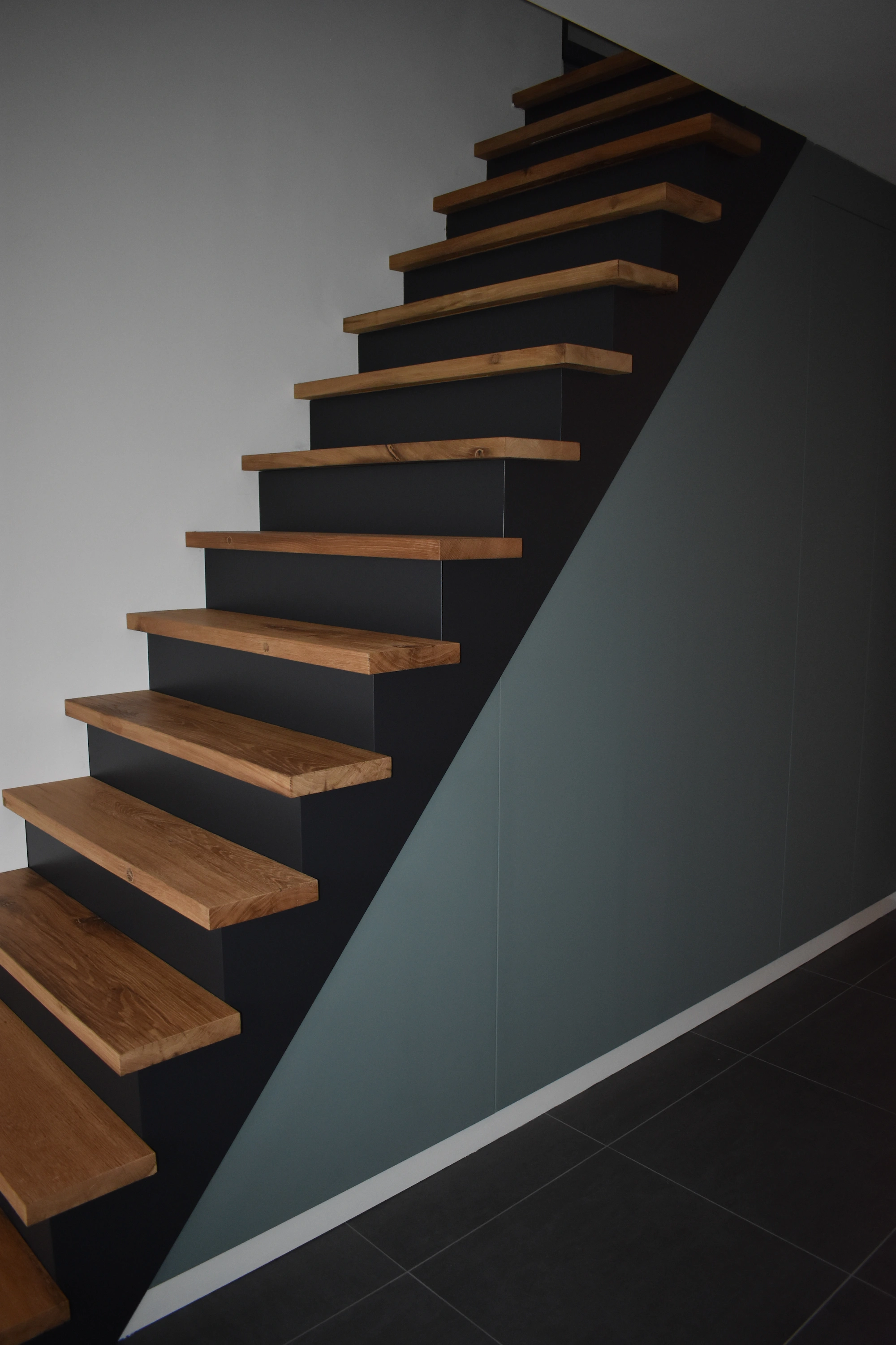 Interior staircase made from reclaimed old oak wood with rustic charm.
