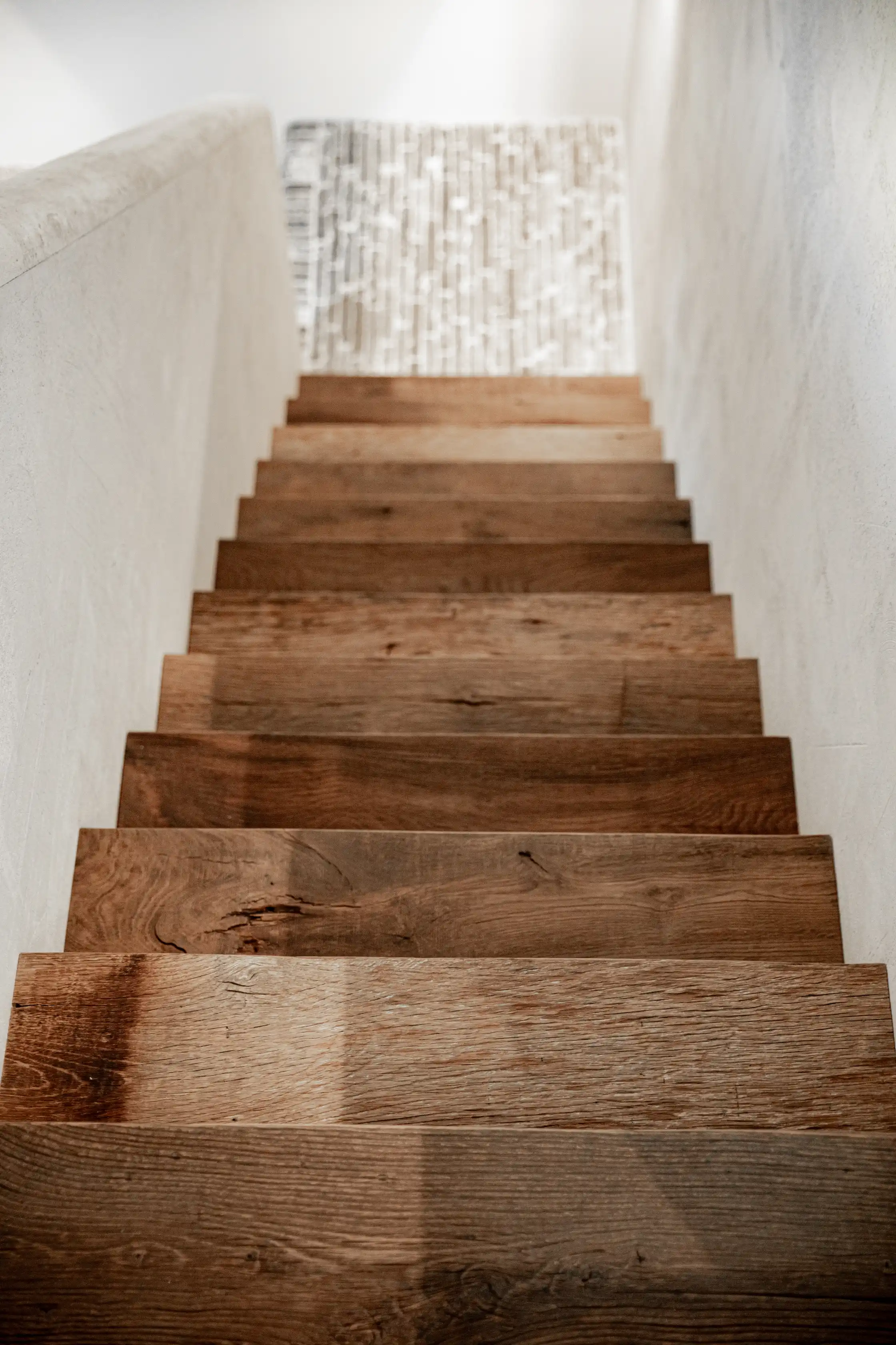 Rustic oak staircase with authentic aged wood character and visible knots.