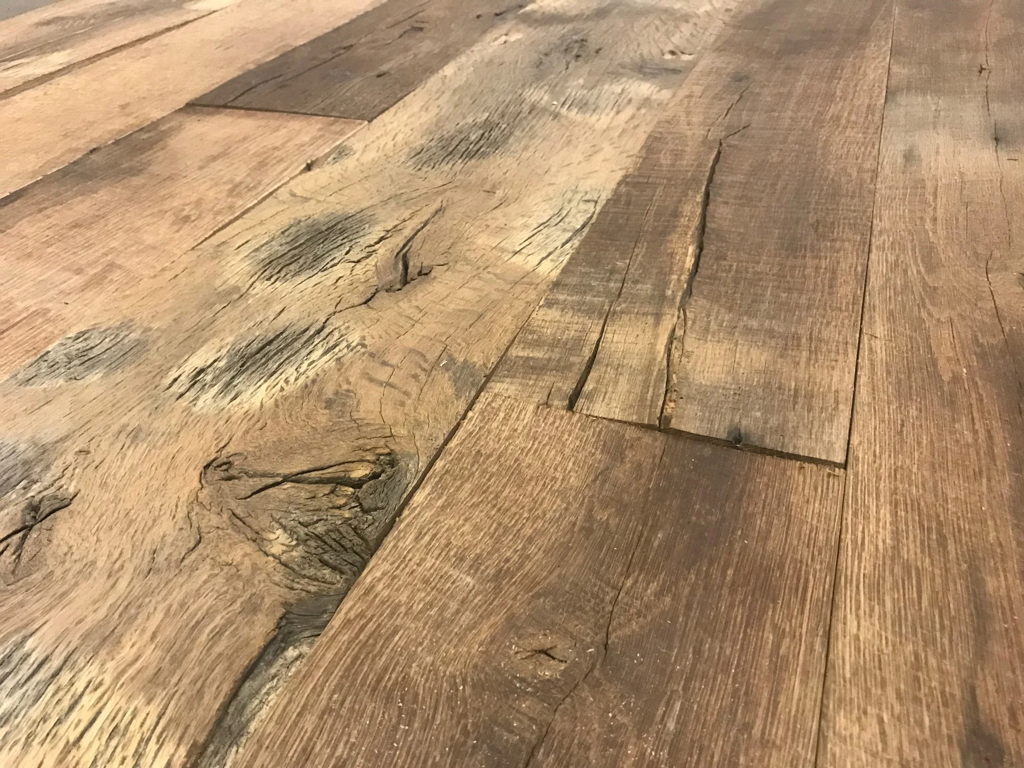 Premium reclaimed oak wooden floor with handcrafted appearance and warm natural tones