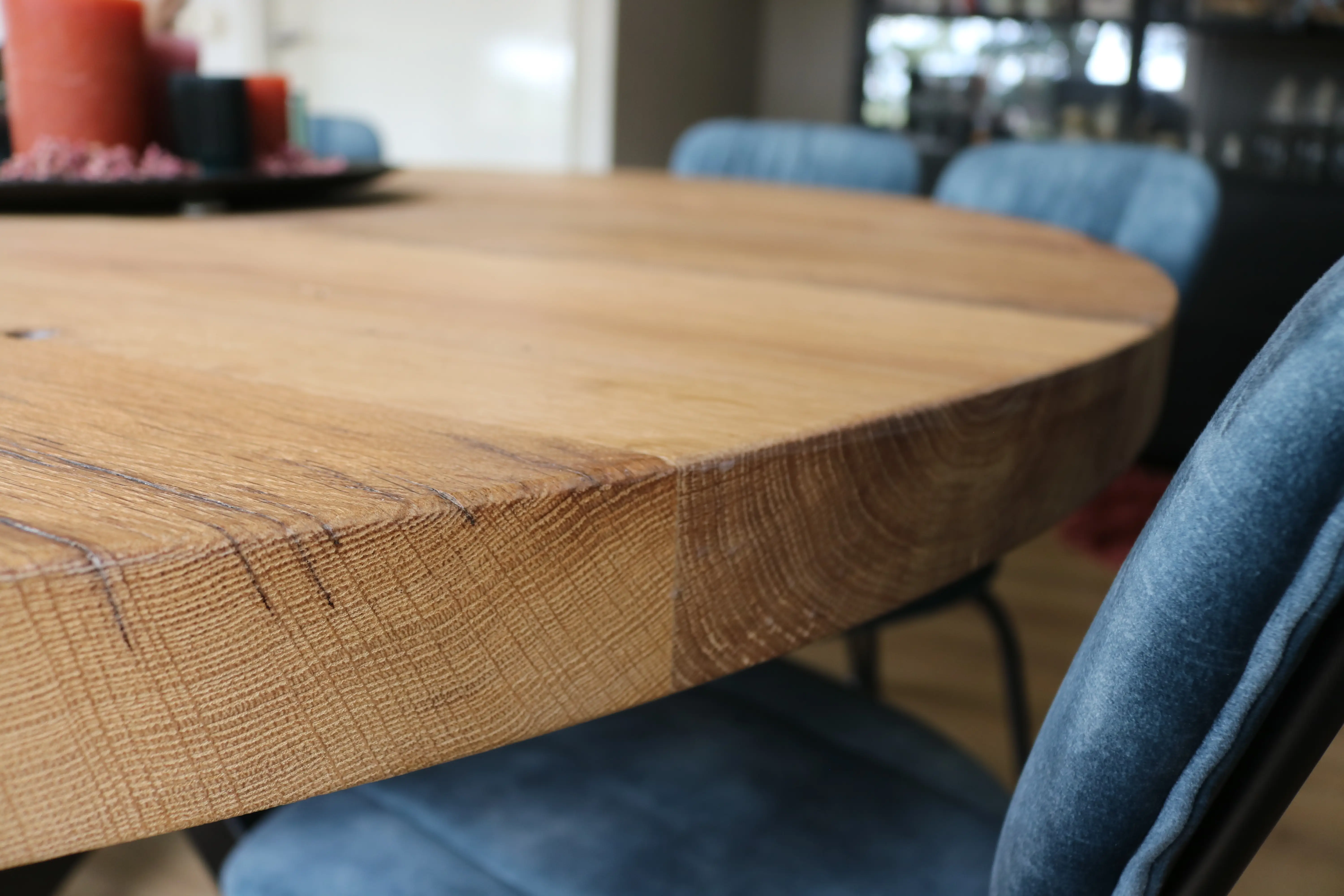 Close-up of old oak tabletop with natural grain patterns and aged patina.
