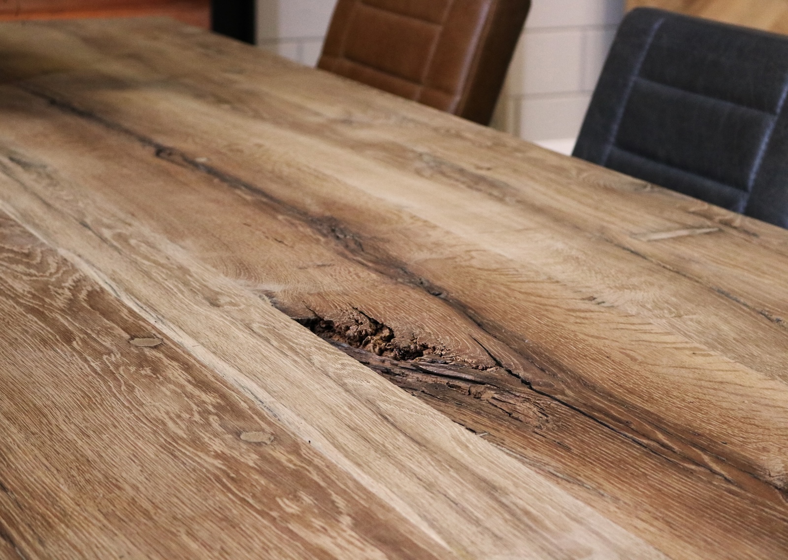 Close-up of old oak tabletop with timeless rustic character.