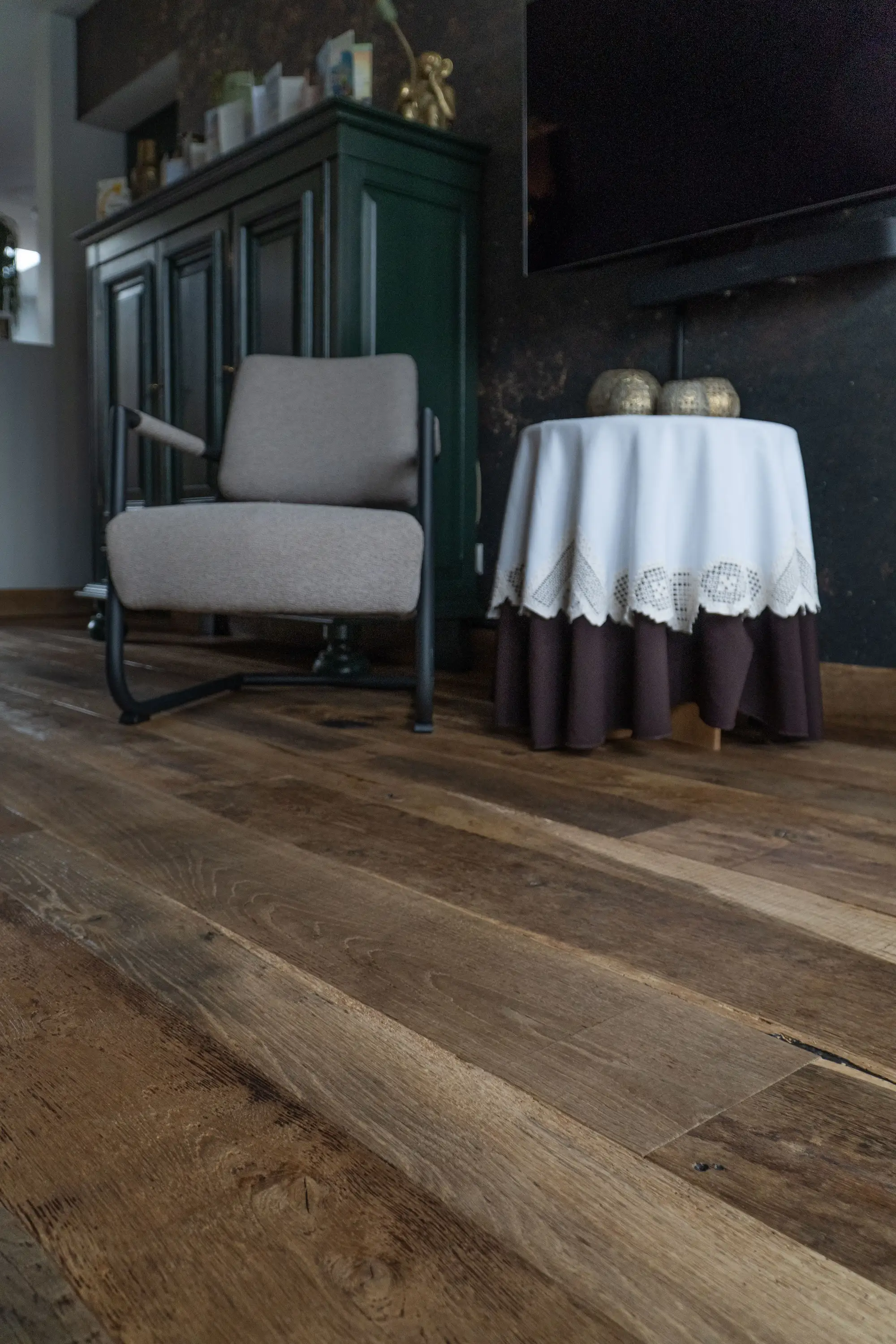 Dark stained oak floorboards with authentic grain patterns and timeless rustic appearance