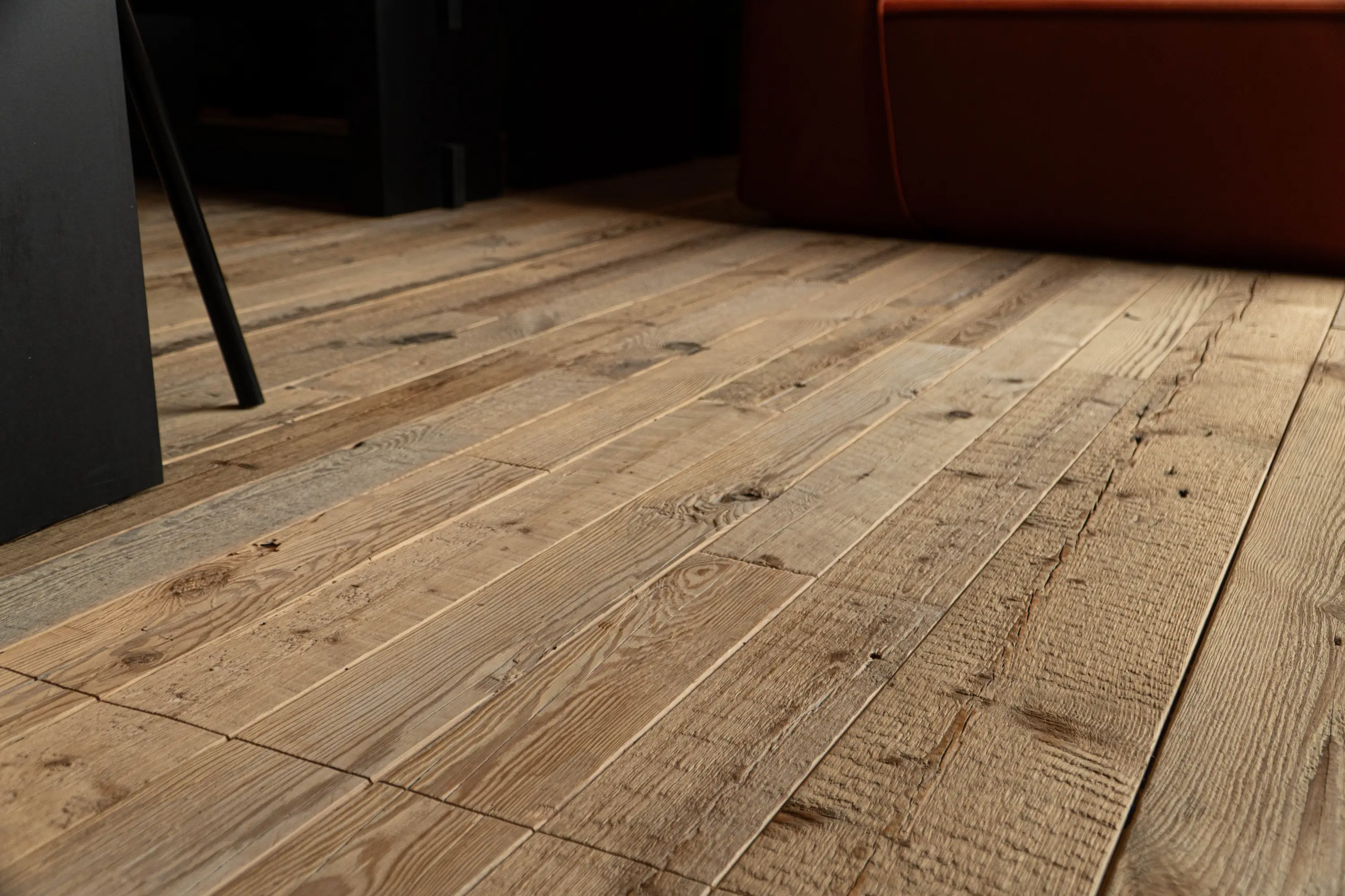 Oak flooring with weathered texture and warm brown tones in a classic interior