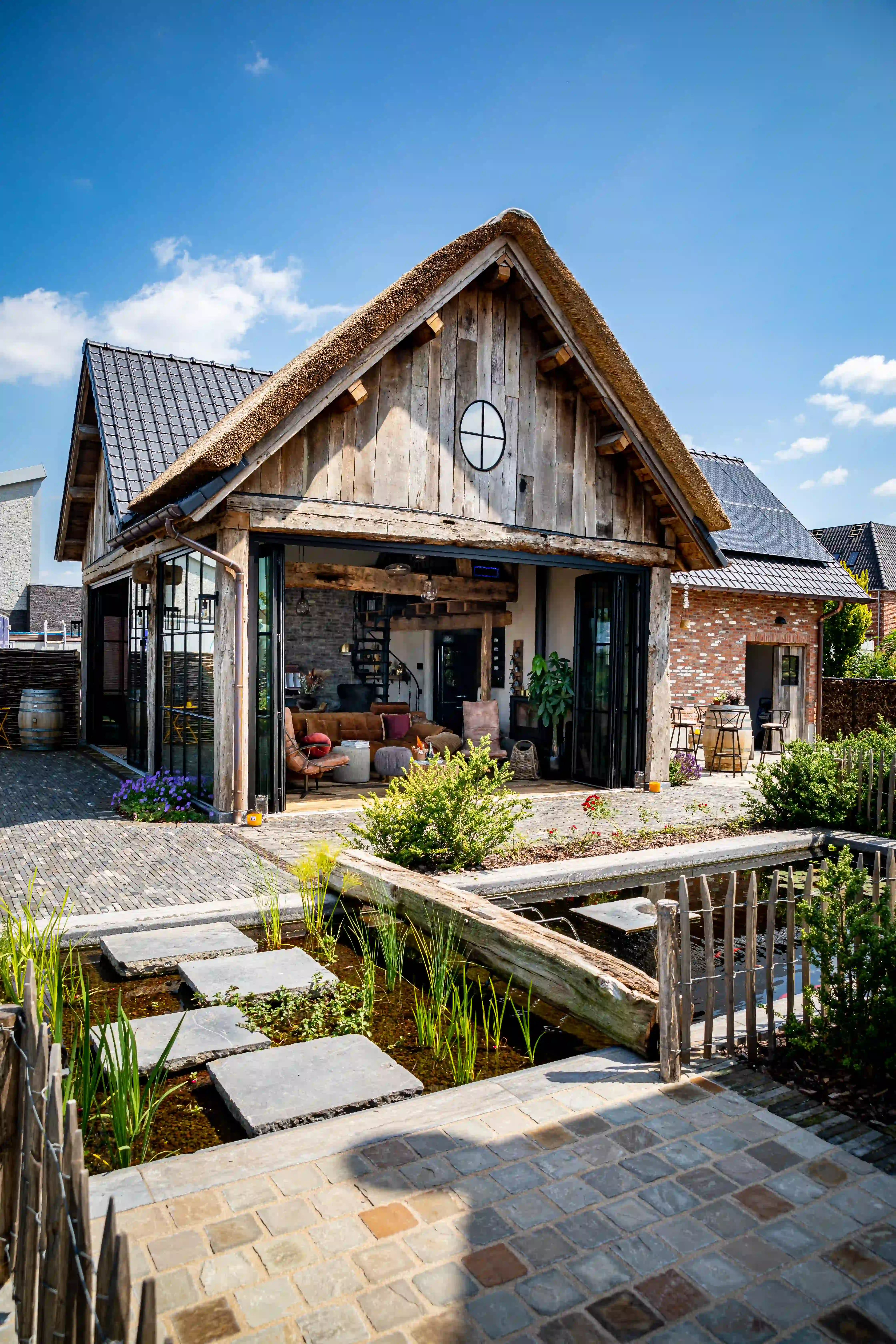 Rustic house exterior featuring reclaimed wood cladding and timber details
