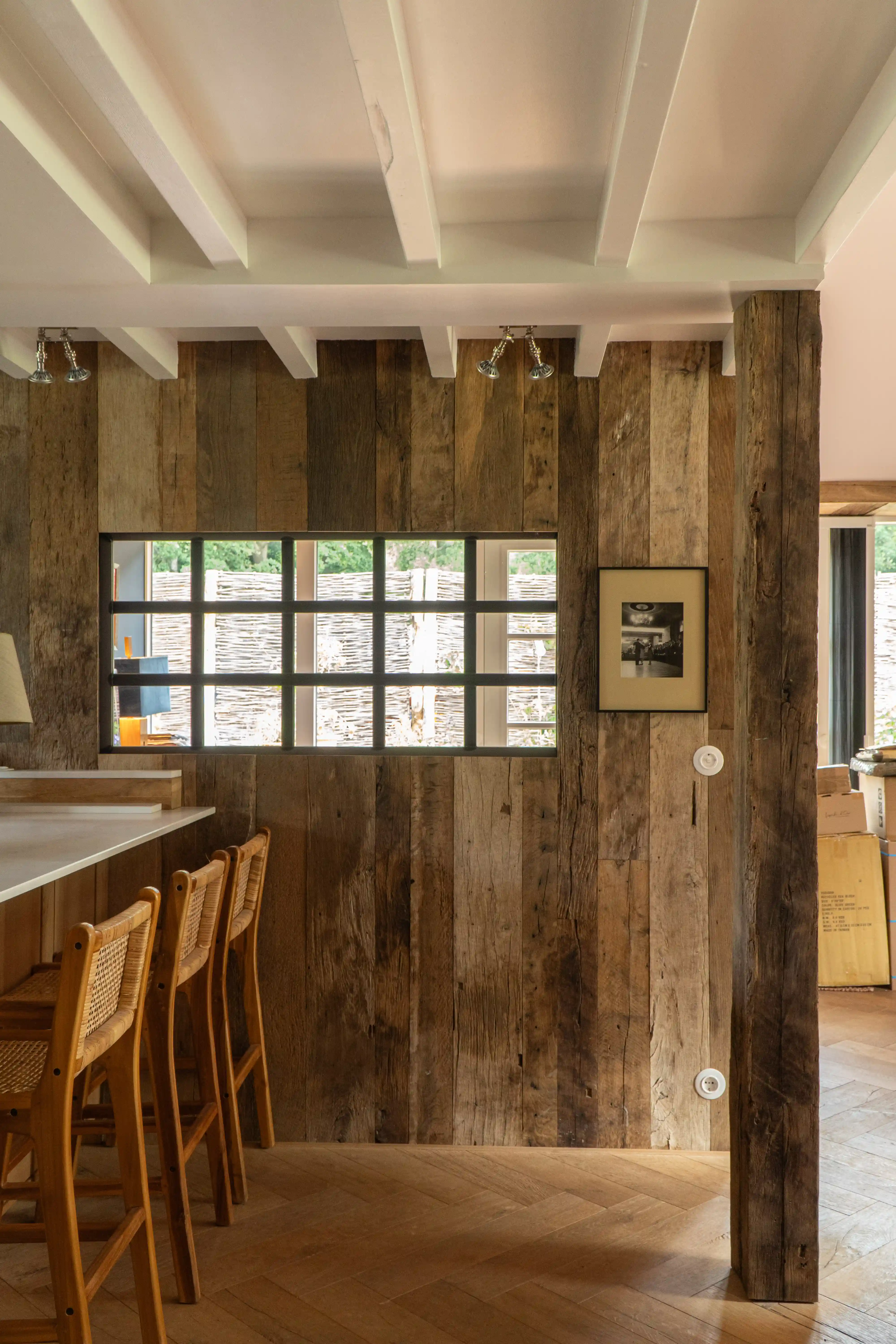 Reclaimed wood wall with mixed tones and natural surface texture