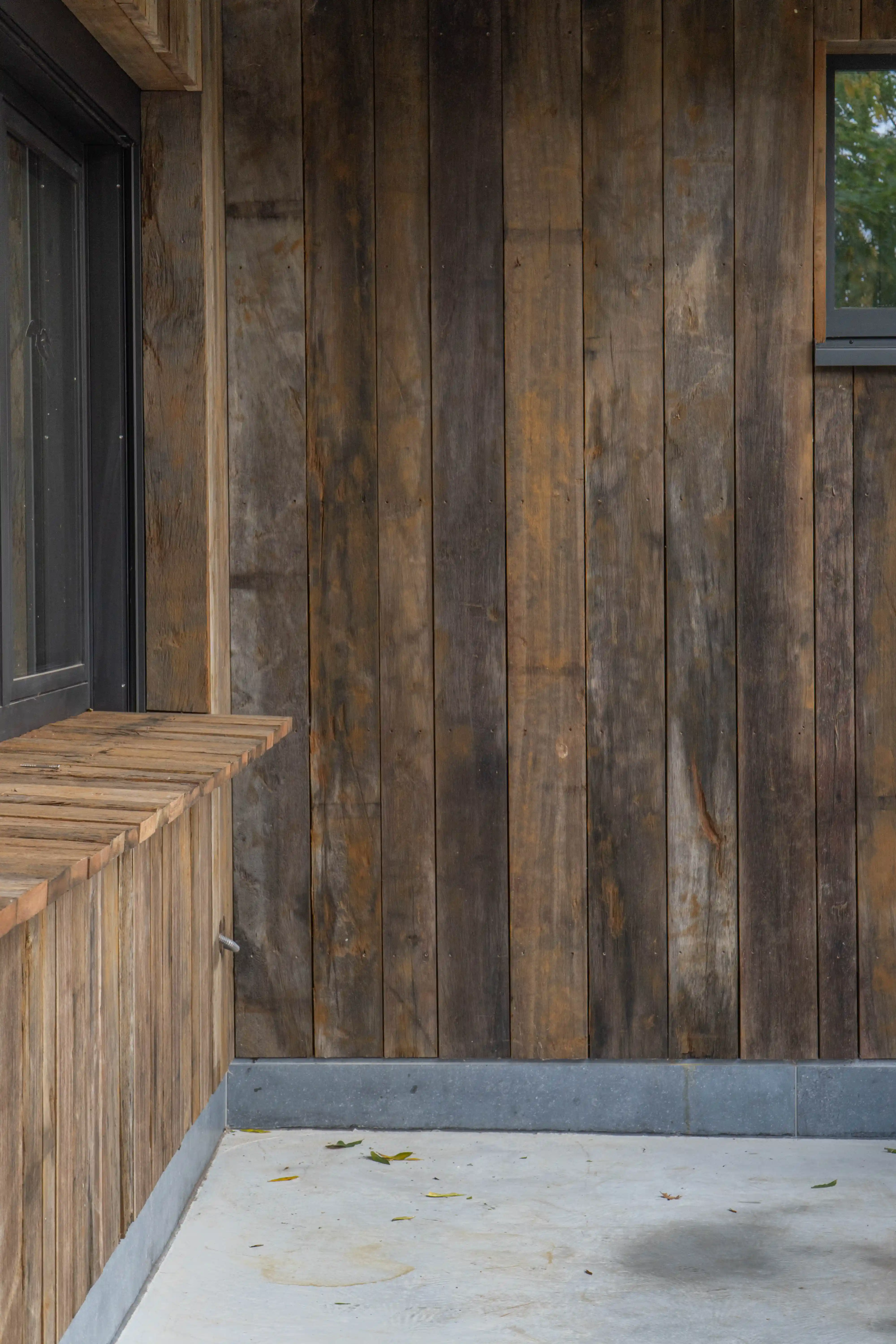 Exterior cladding made of reclaimed oak with rustic texture
