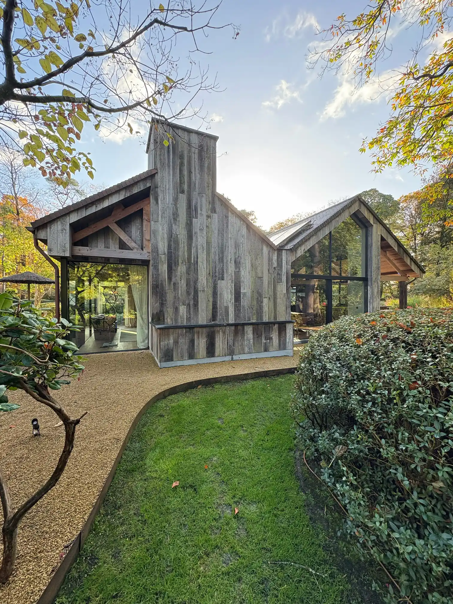 Rustic timber facade featuring vertical reclaimed wood panels and natural aged texture.