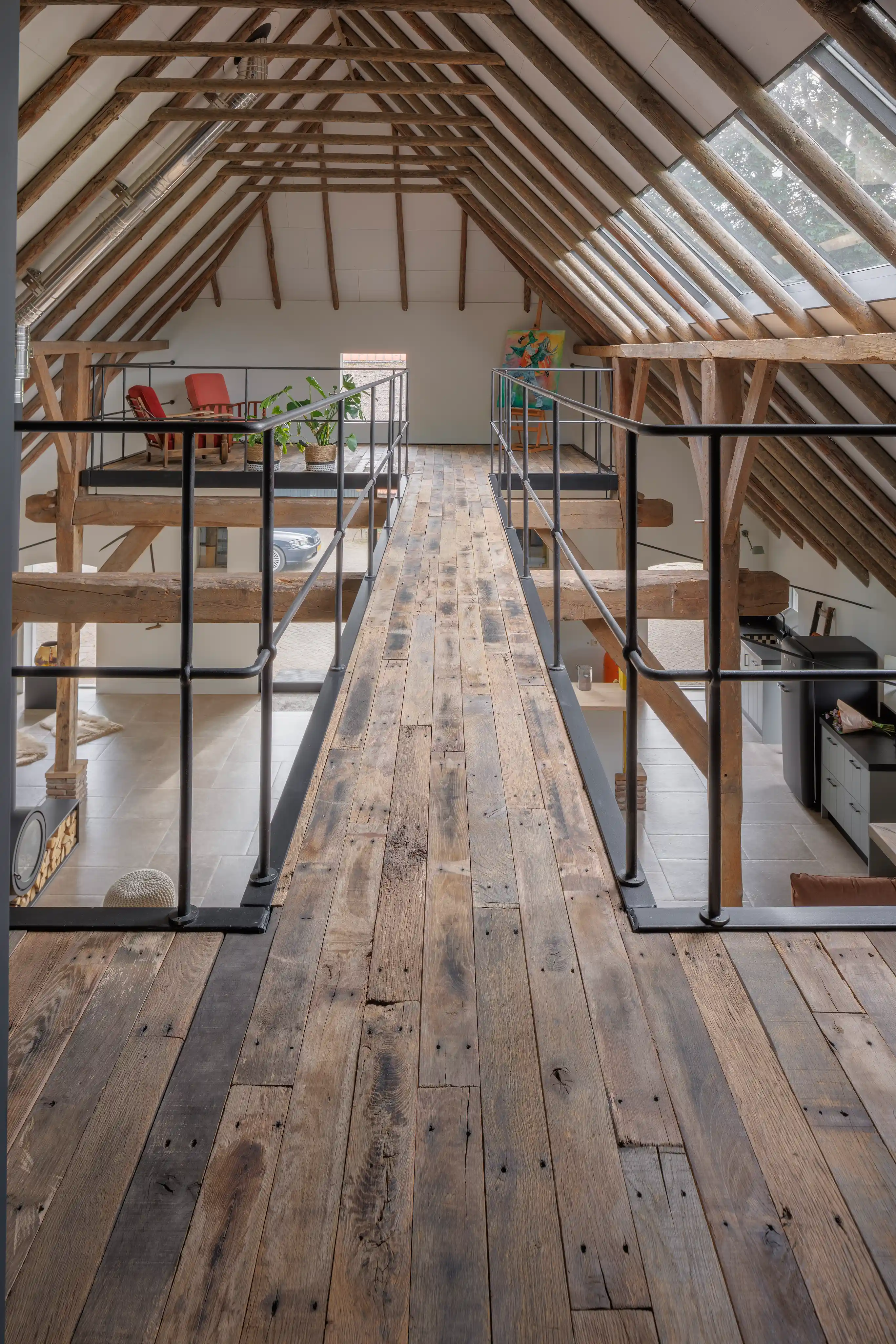 Reclaimed oak flooring with wide rustic planks in a spacious loft style interior