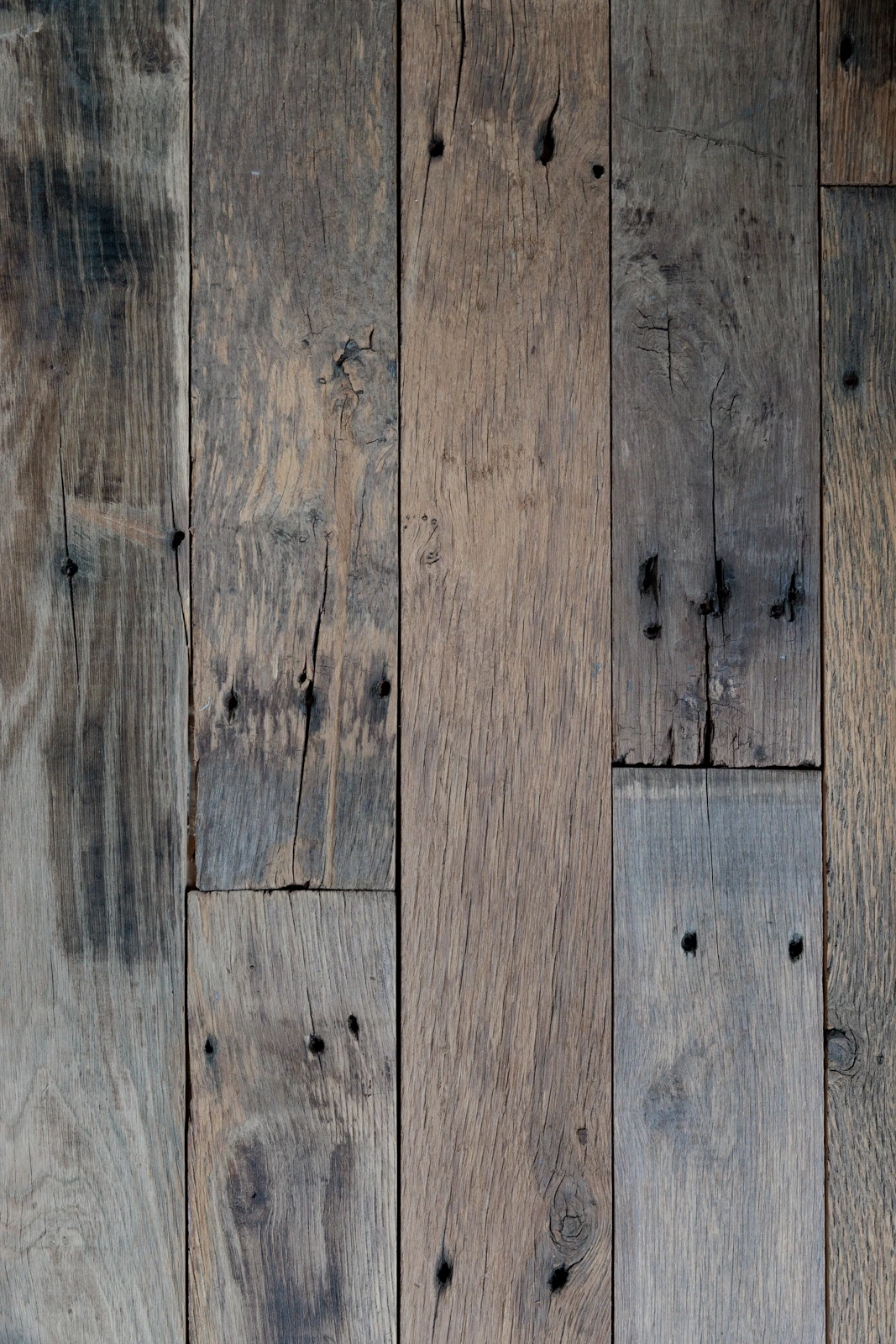 Wall covered with reclaimed wood panels showing texture and variation