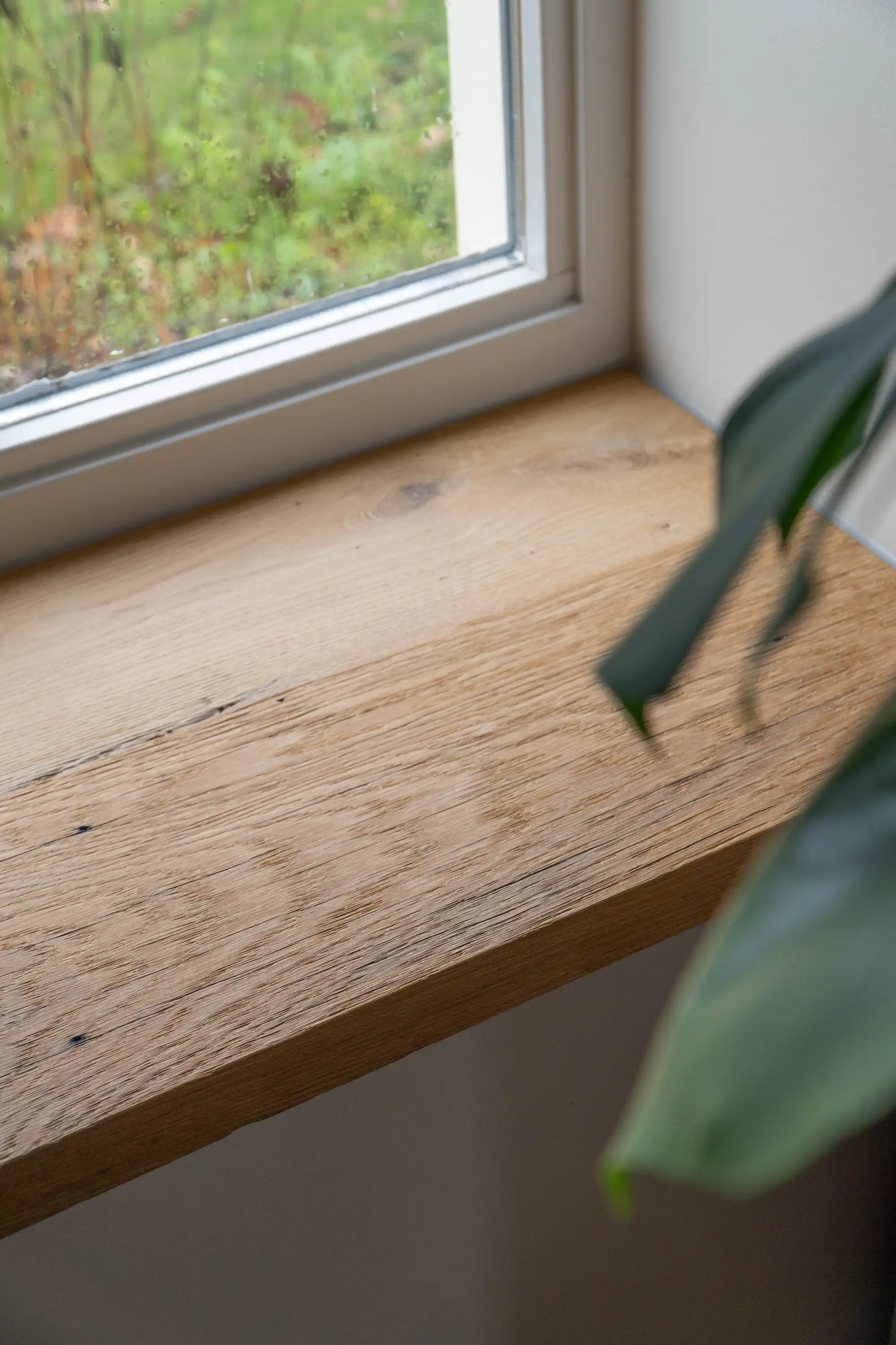 Rustic reclaimed wood window sill with natural grain detail