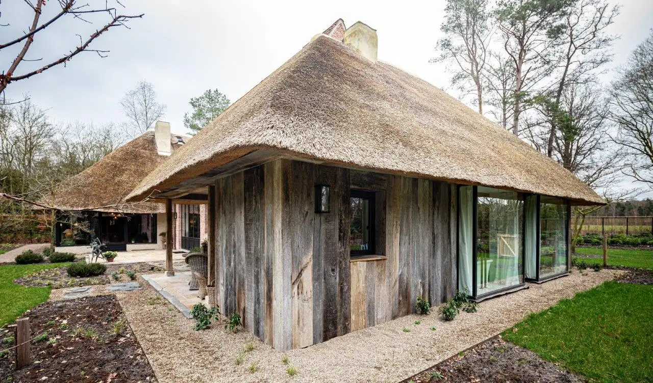 Modern building exterior with reclaimed wood facade panels and rustic finish.
