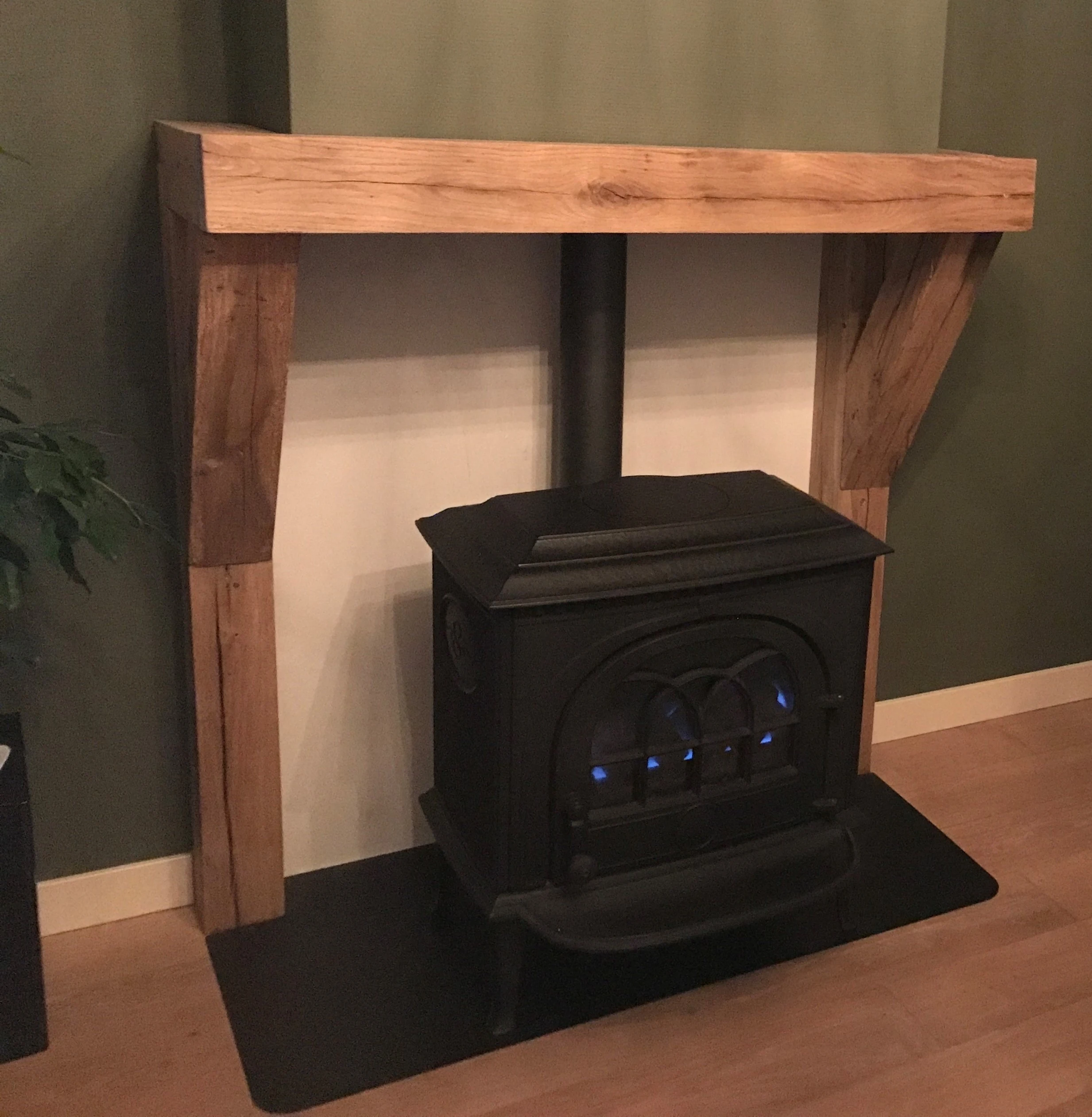 Fireplace mantel made from old oak with warm tones