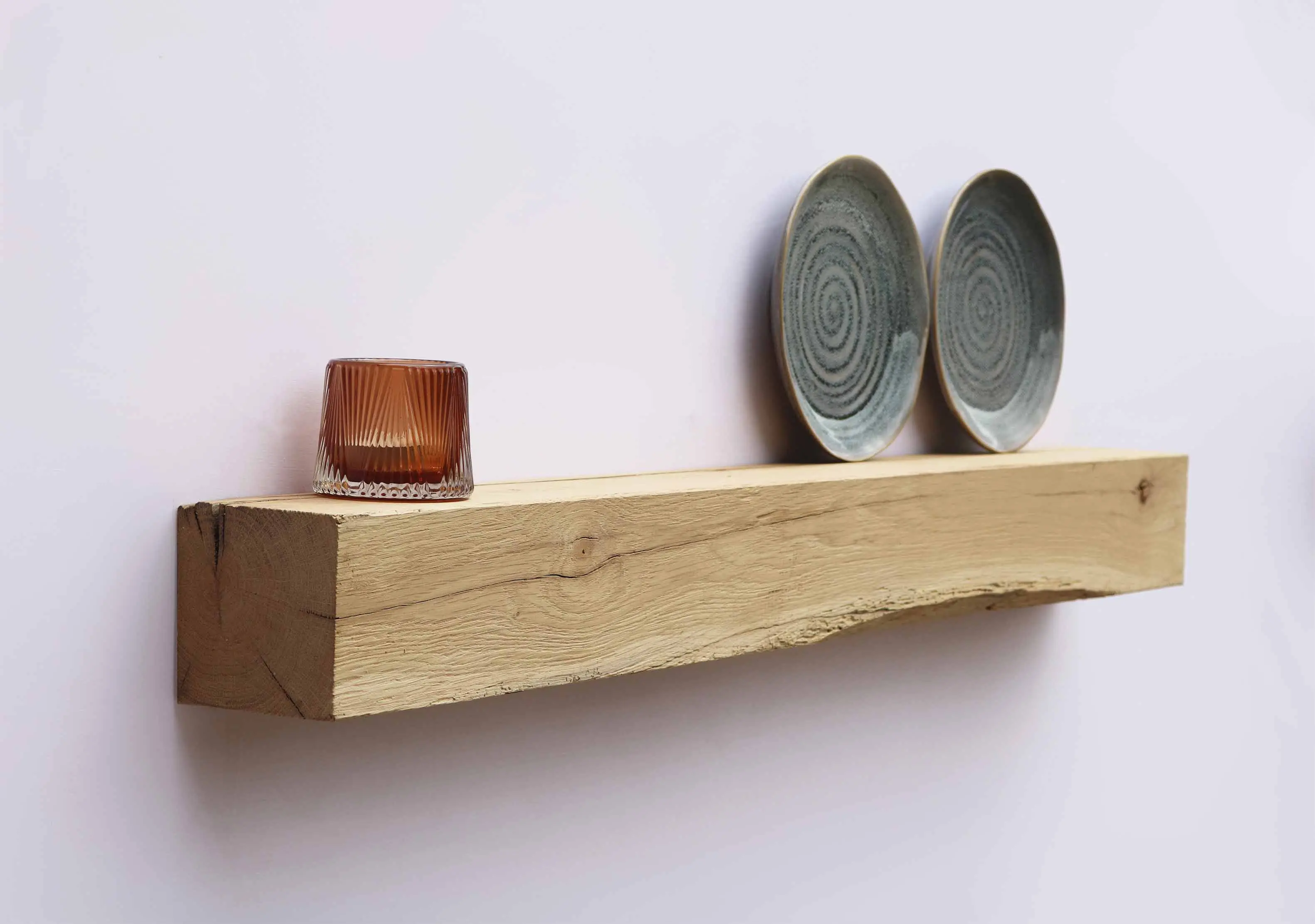 Sustainable reclaimed wood floating shelf combined with soft neutral interior styling