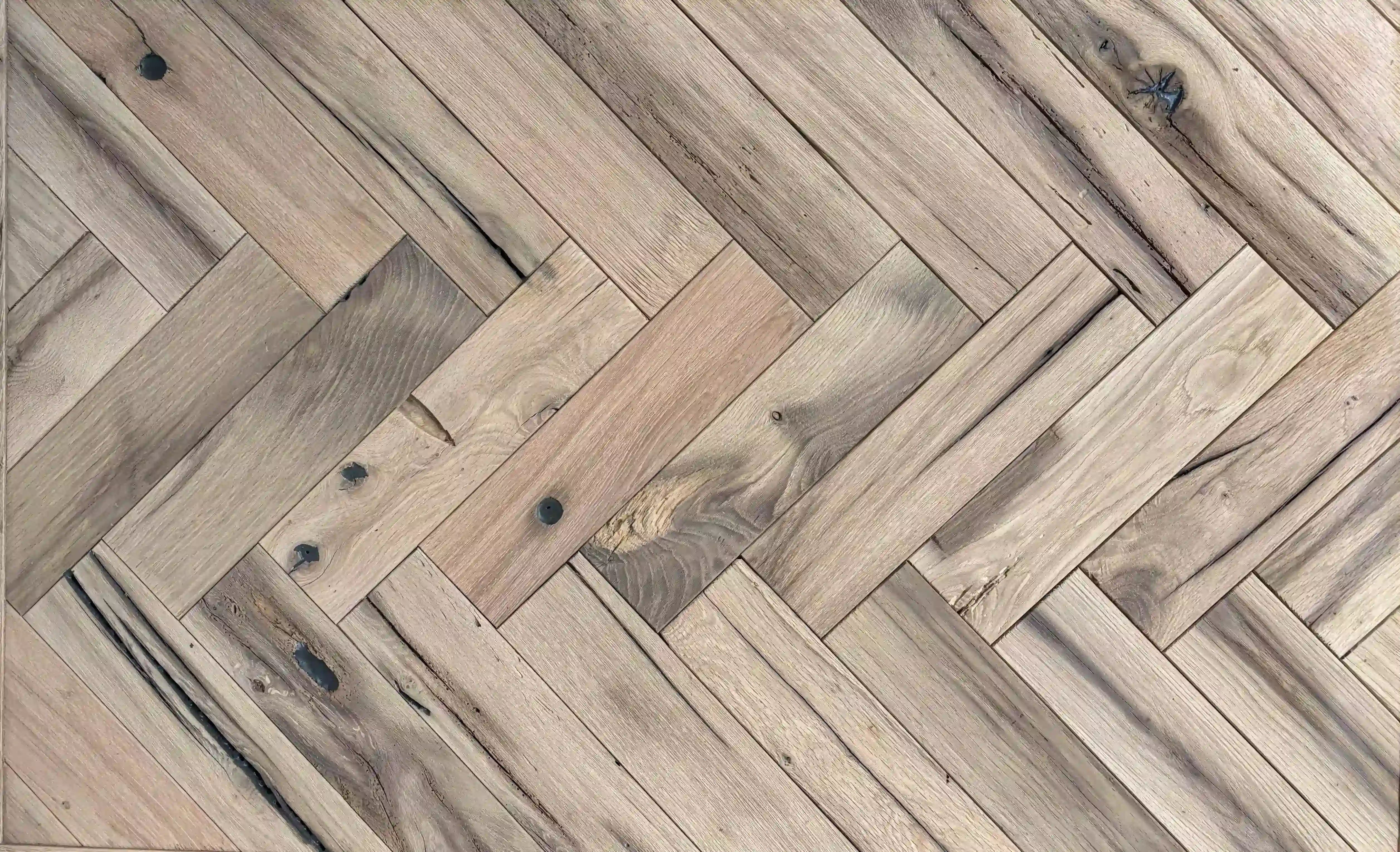 Sustainable reclaimed oak herringbone flooring creating a luxurious and natural interior atmosphere