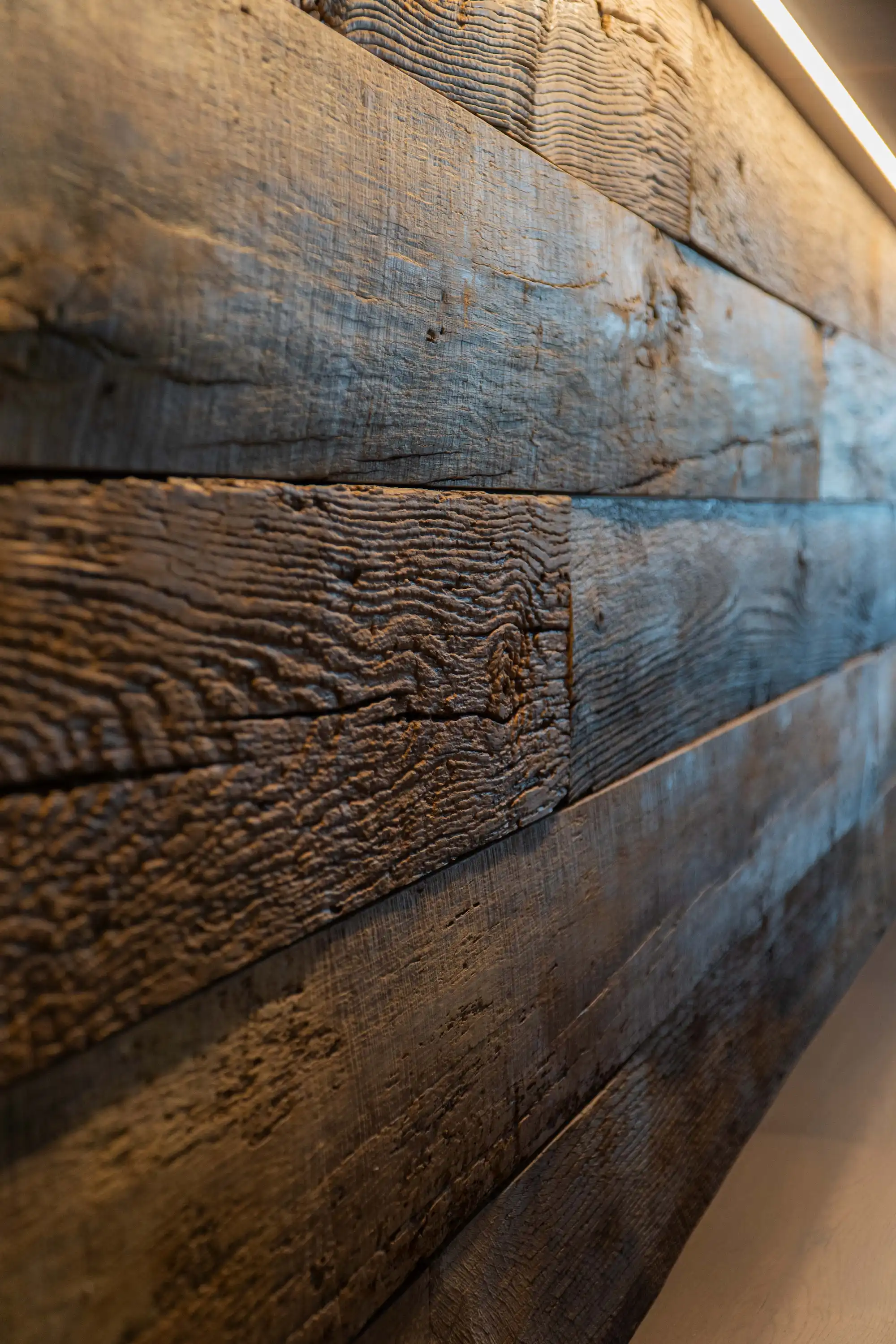 Close-up of reclaimed oak panels with a rich natural texture.