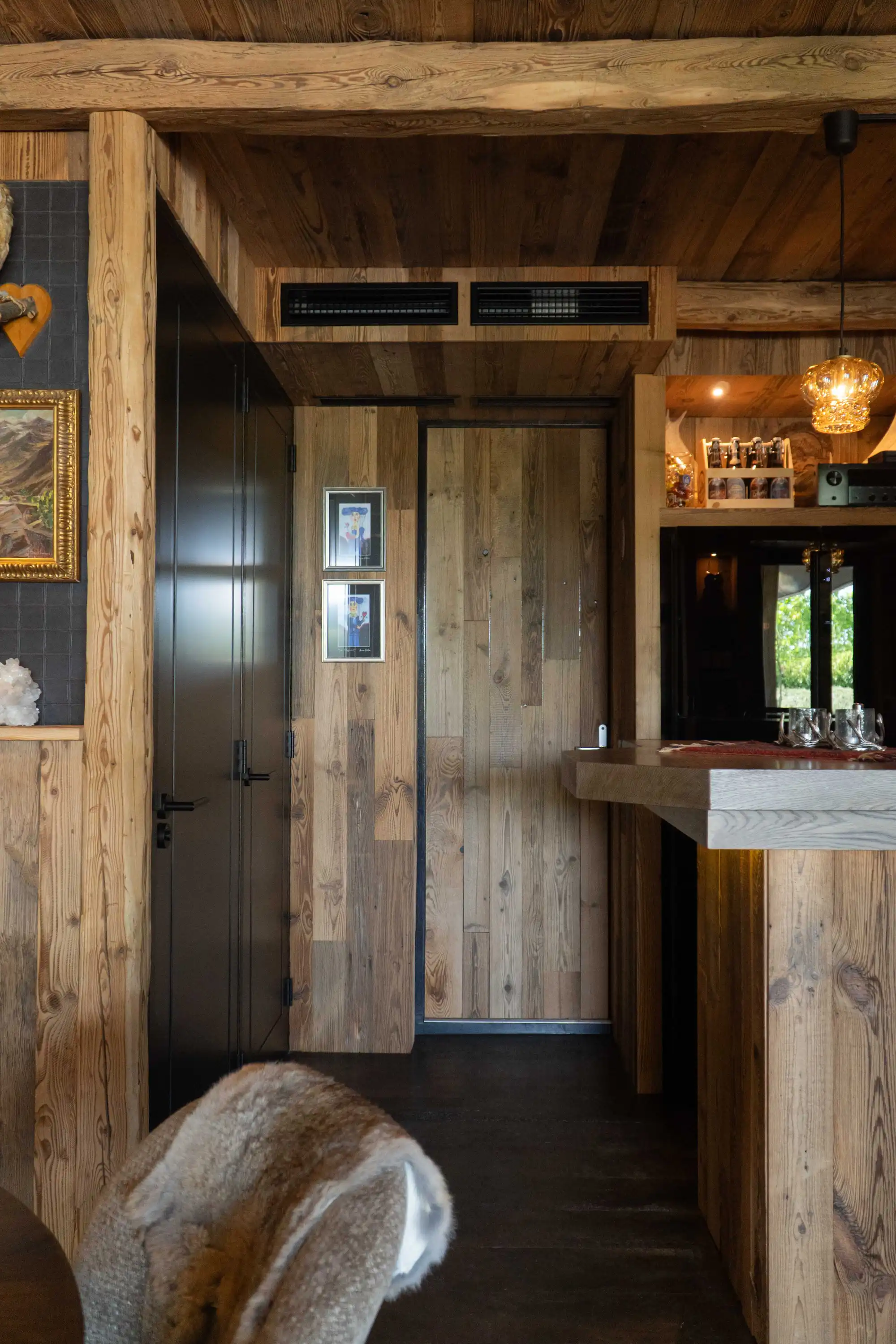 Authentic reclaimed pine interior with warm natural textures.