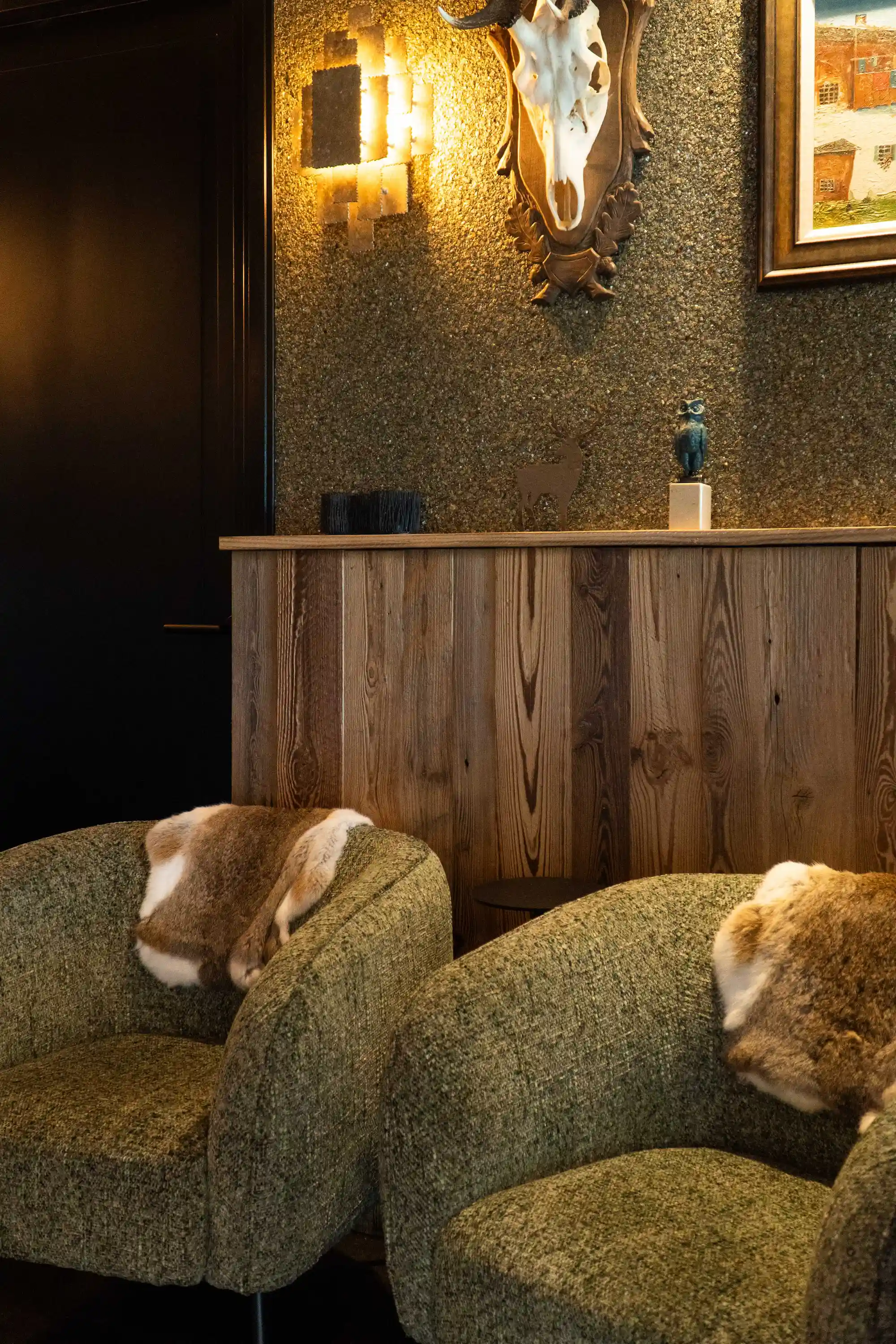 Reclaimed pine wall cladding adds warmth and character to this inviting interior.