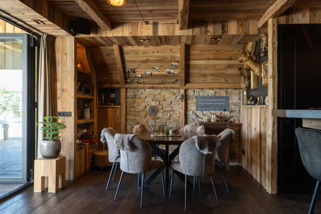 Bespoke shelving integrated into reclaimed pine wall cladding