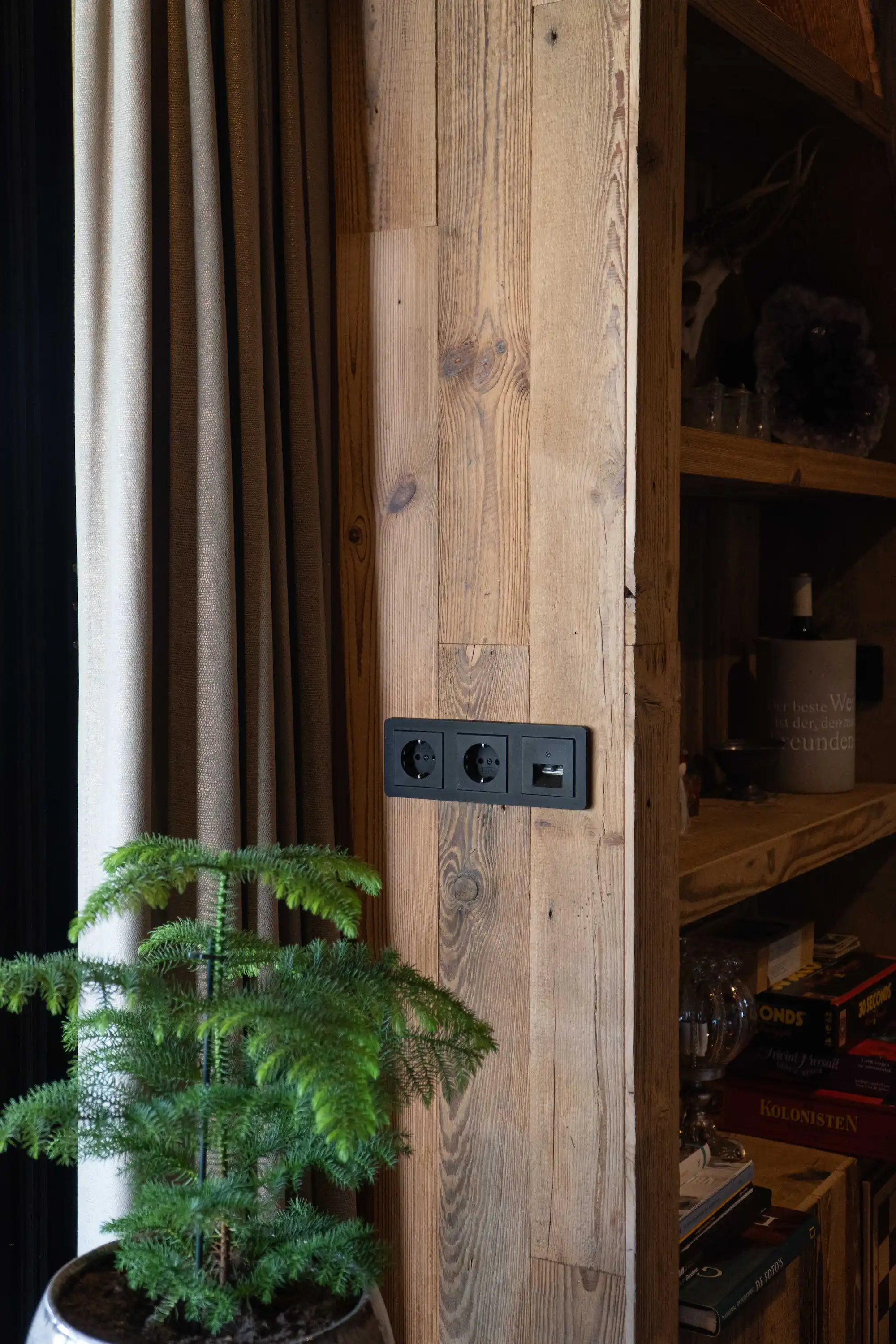 Detailed view of reclaimed pine wall cladding and shelving.