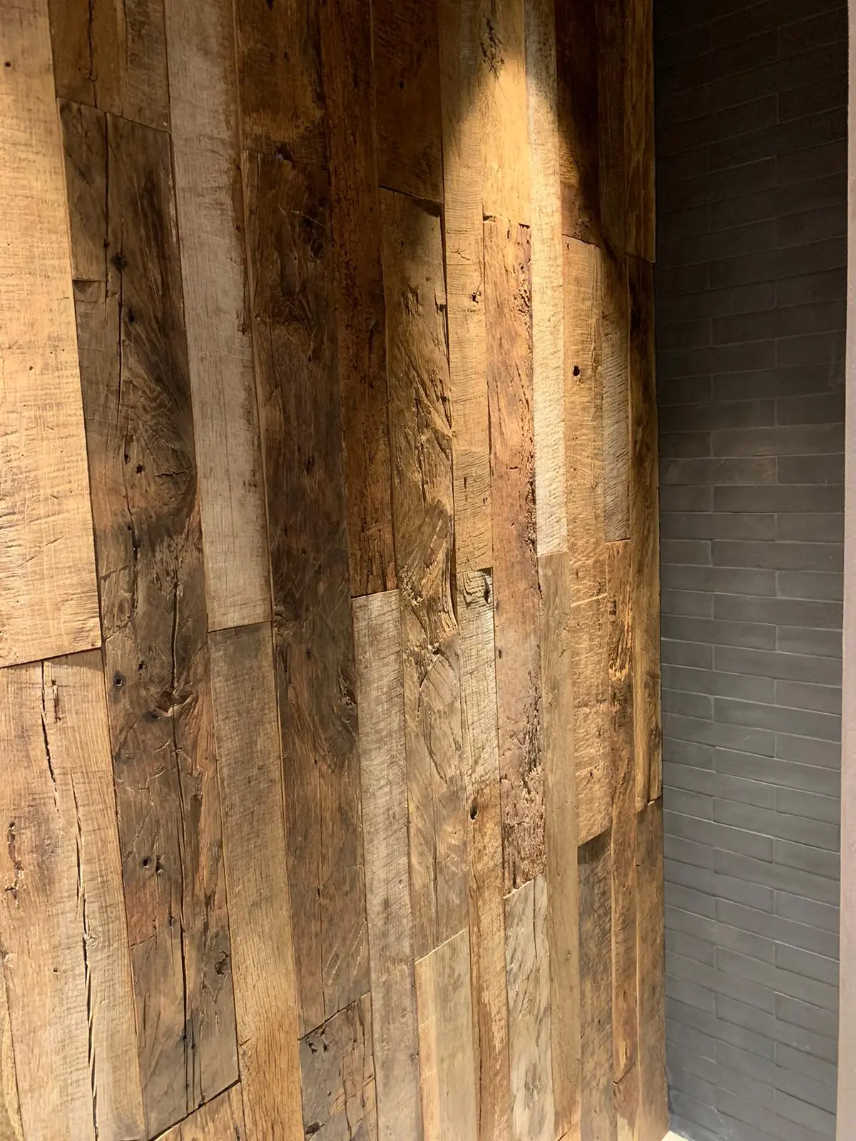 Reclaimed oak wall cladding with a rustic natural finish