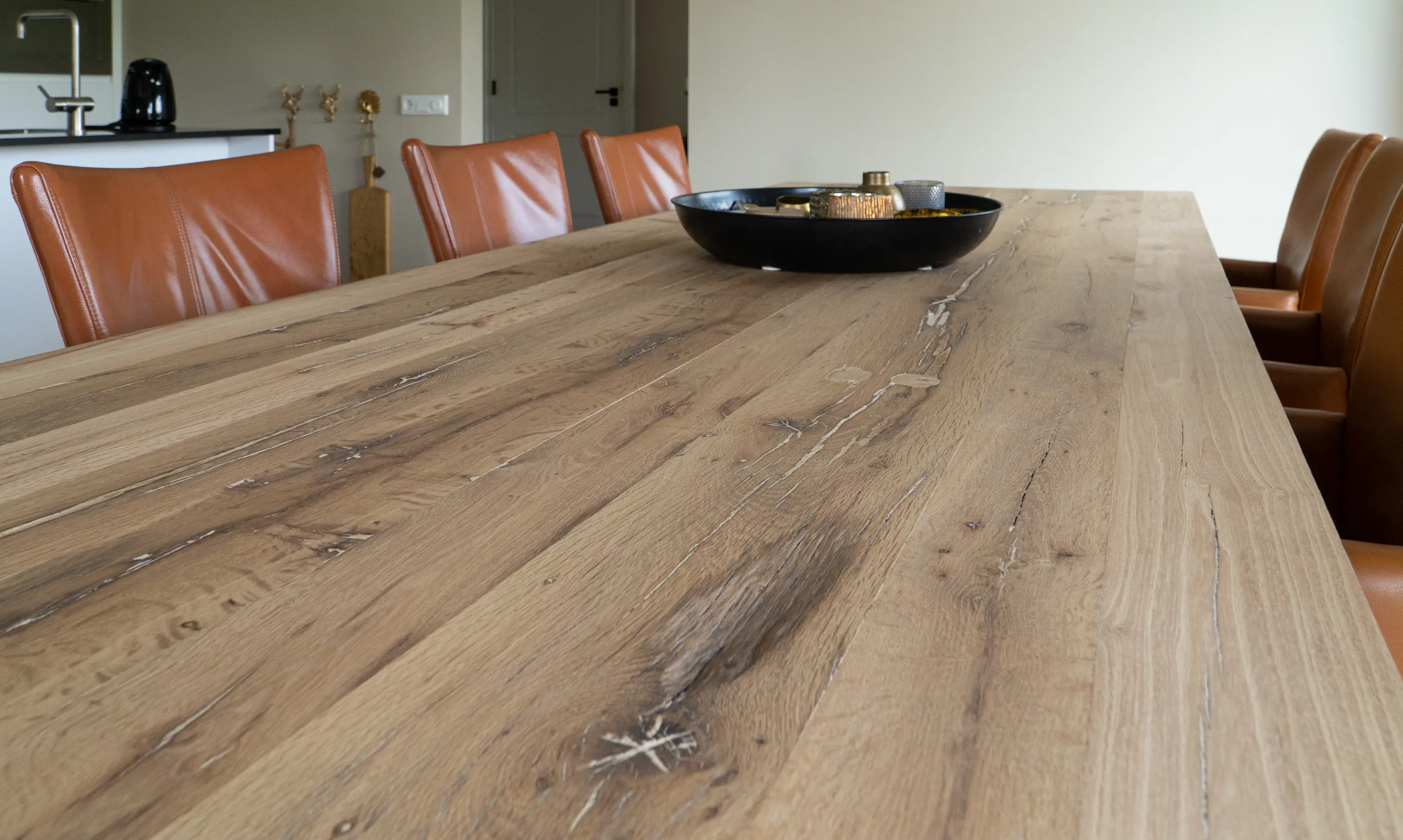 Characterful reclaimed oak dining table with natural grain, knots and authentic signs of age